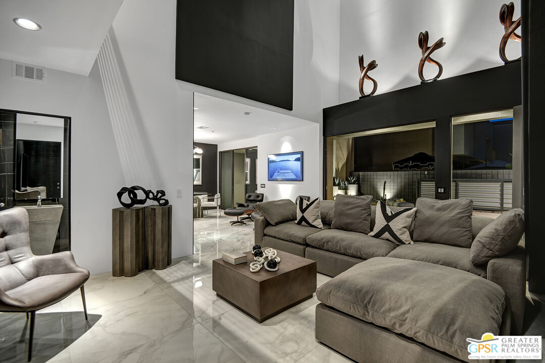 1508 East Baristo Road Palm Springs, CA 92262 - Photo 55 of 62 a living room with furniture and a flat screen tv