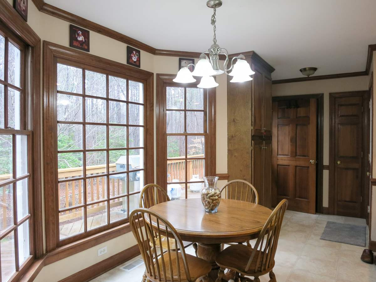 14008 Bingham Drive Raleigh, NC 27614 - Photo 9 of 30 The sunny bay-windowed B’fast area has a lg pantry cabinet. Nearby is the rear entry area w/access to the Deck & door to the oversize 2-car Garage w/StorageRm, & to back stairs to the BonusRm. Breakfast Area