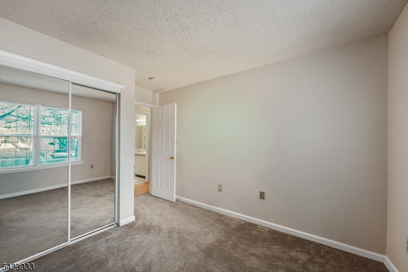 159 West Market Street Newark, NJ 07103 - Photo 13 of 18 an empty room with sliding glass door