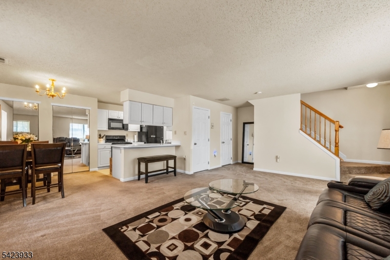 159 West Market Street Newark, NJ 07103 - Photo 3 of 18 a living room with furniture and a rug