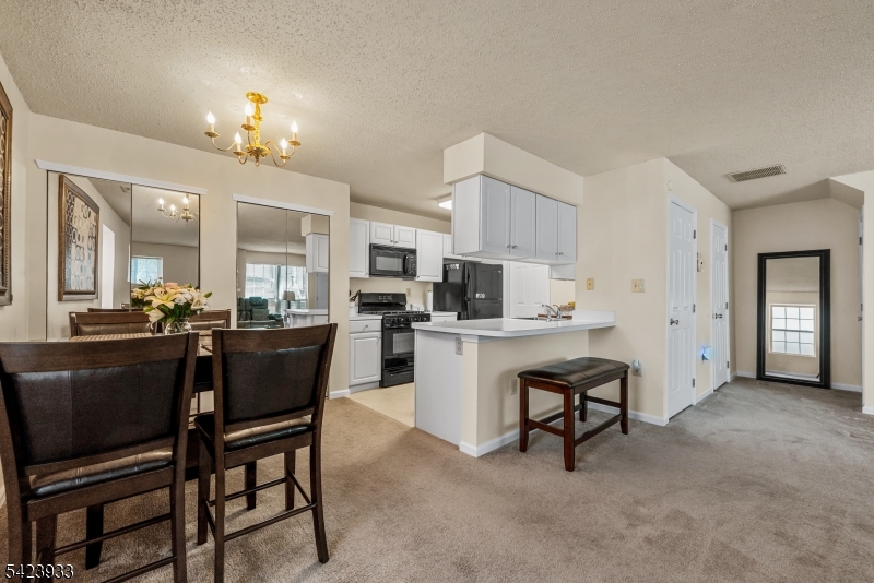 159 West Market Street Newark, NJ 07103 - Photo 5 of 18 a view of kitchen with dining table and chairs