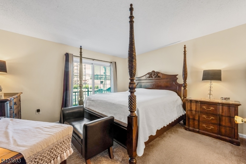 159 West Market Street Newark, NJ 07103 - Photo 9 of 18 a bedroom with a bed and window