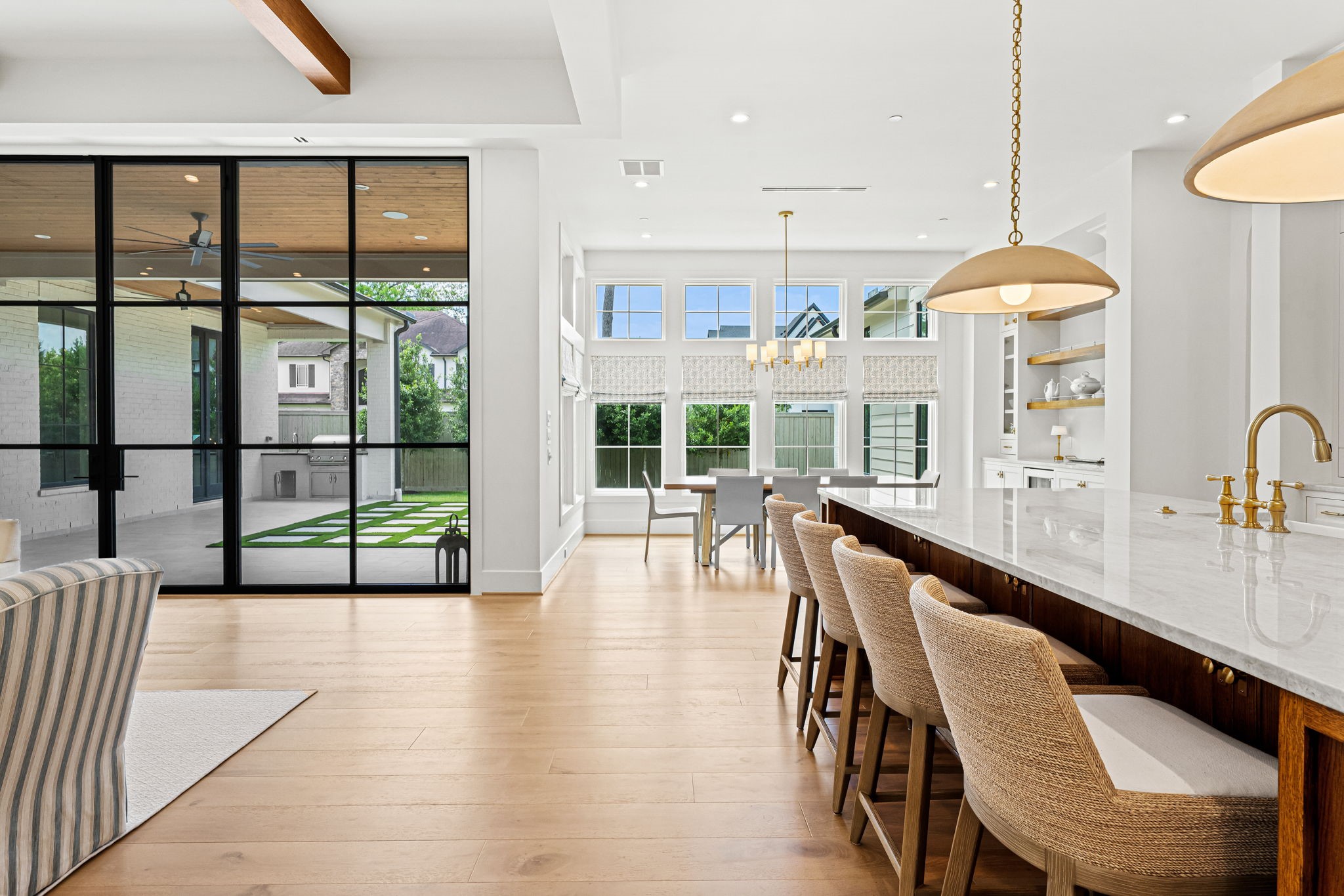 8722 Lupton Lane Houston, TX 77055 - Photo 13 of 44 a dining room with wooden floor windows and a chandelier