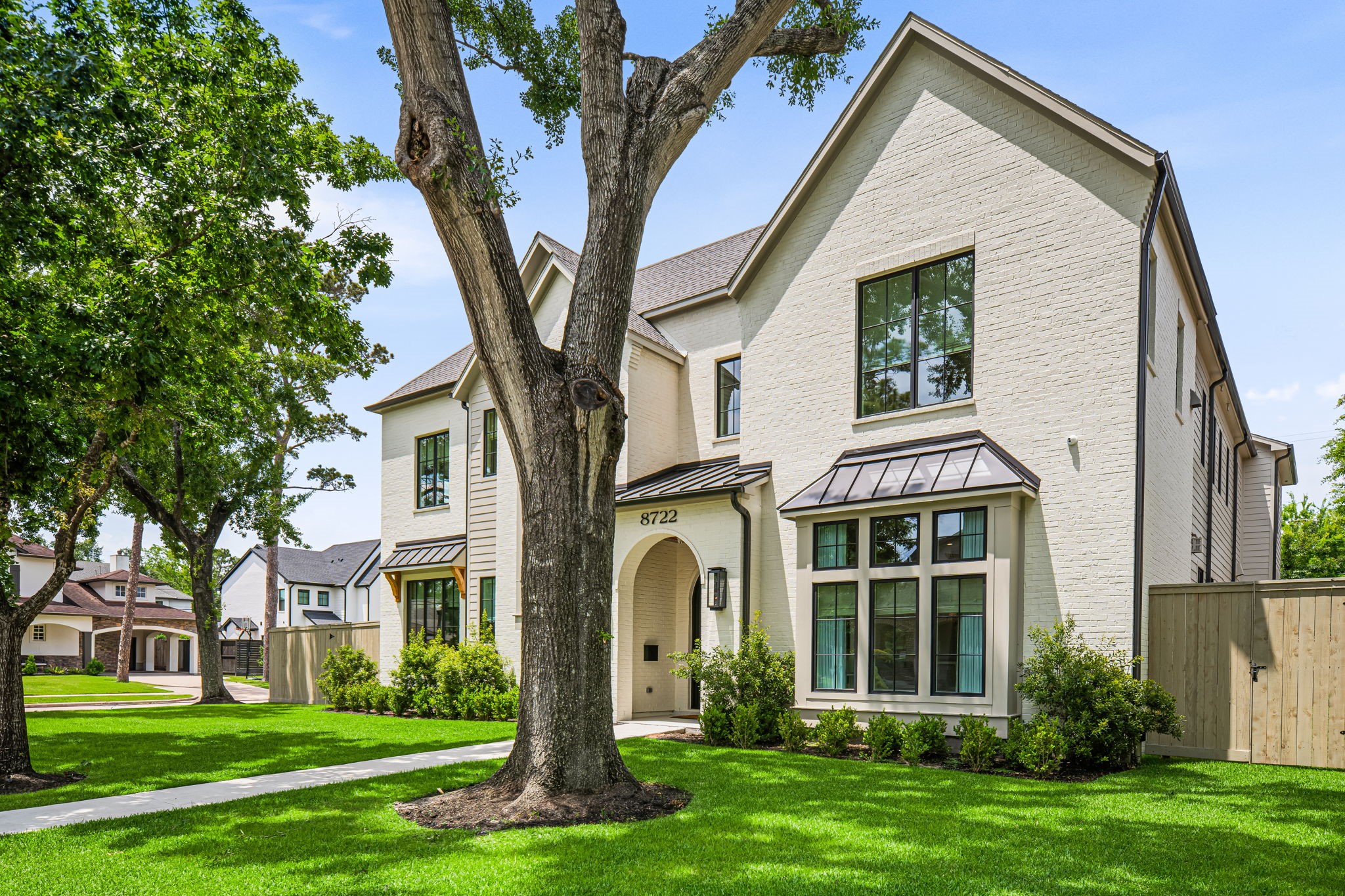 8722 Lupton Lane Houston, TX 77055 - Photo 2 of 44 a front view of a house with a yard