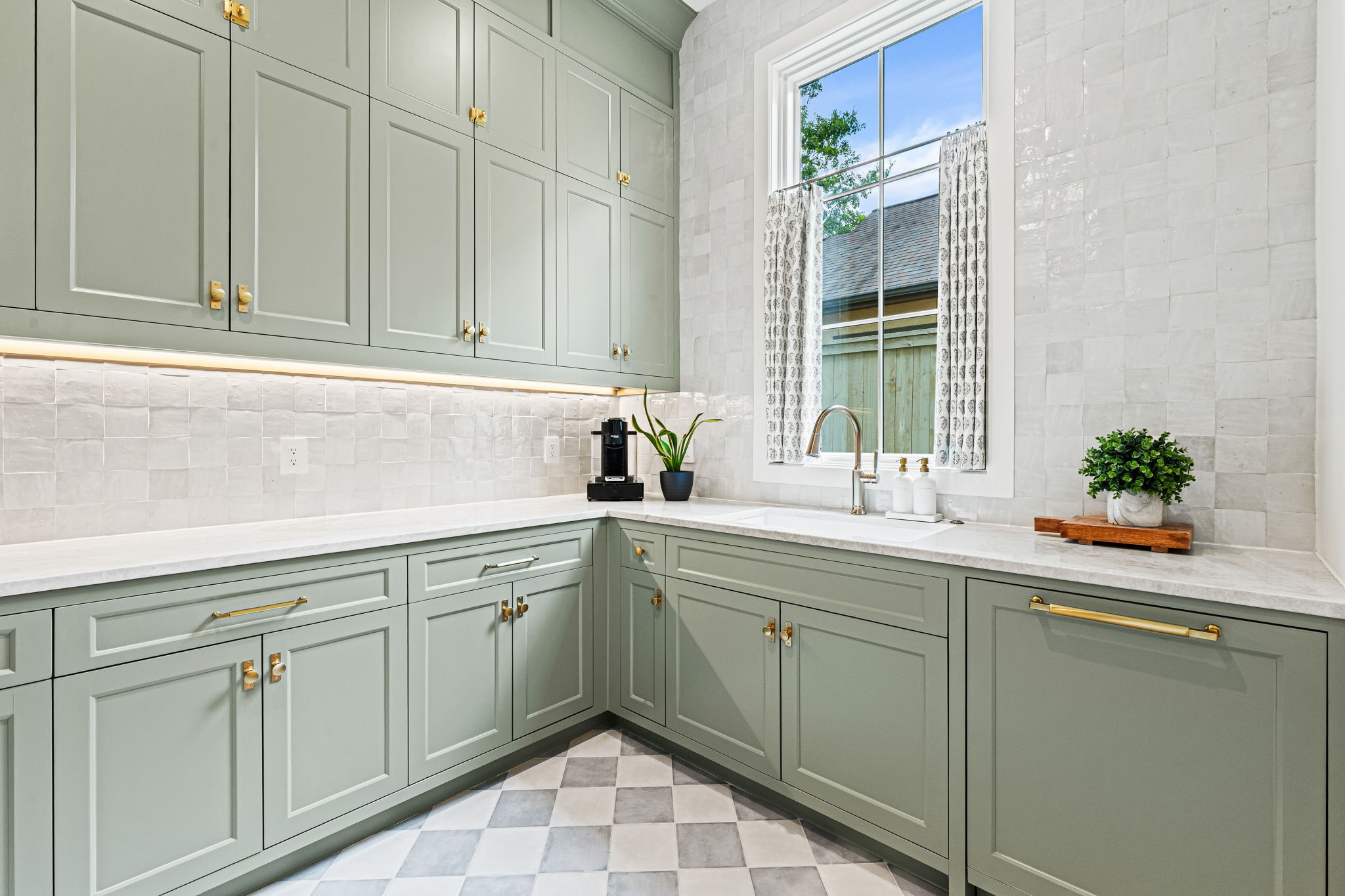 8722 Lupton Lane Houston, TX 77055 - Photo 23 of 44 a sink with white cabinets