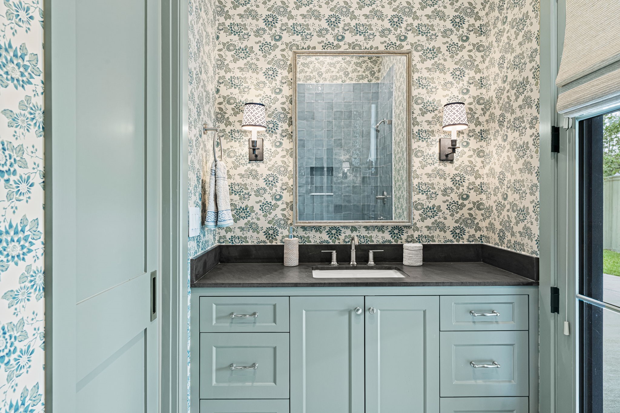 8722 Lupton Lane Houston, TX 77055 - Photo 25 of 44 a bathroom with a granite countertop sink a vanity and a shower