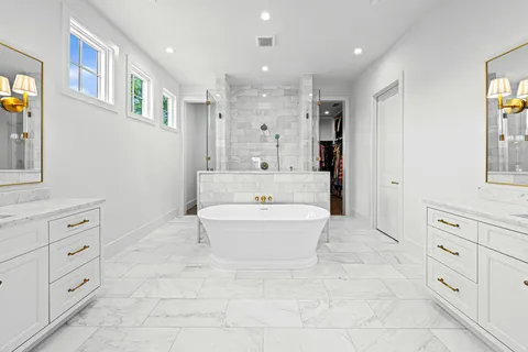 a bathroom with a bathtub shower sink and toilet