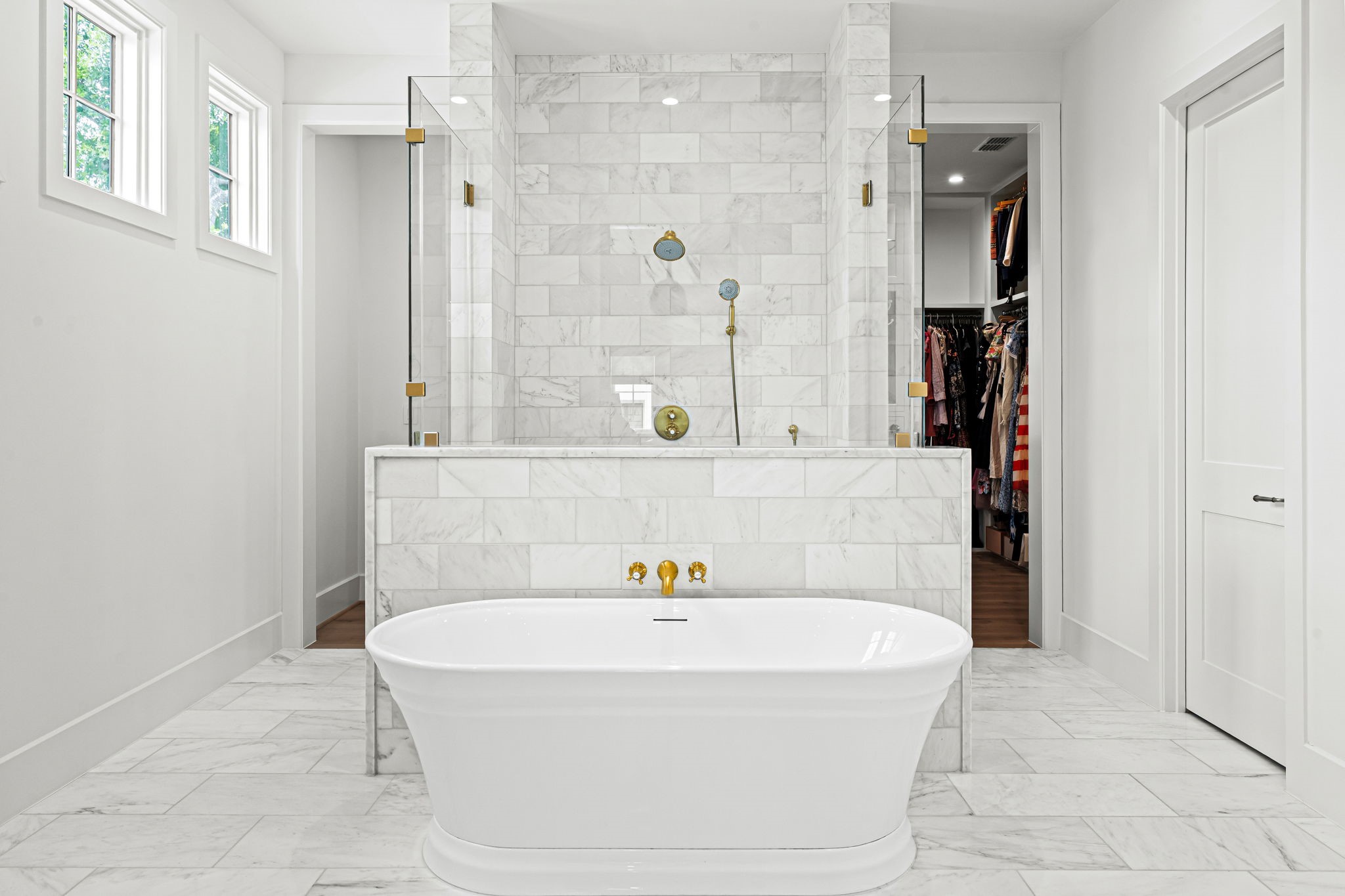 8722 Lupton Lane Houston, TX 77055 - Photo 28 of 44 a bathroom with a bathtub and a shower
