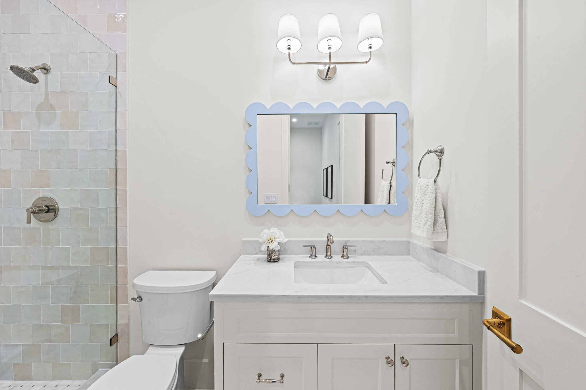 8722 Lupton Lane Houston, TX 77055 - Photo 34 of 44 a bathroom with a sink a toilet and a mirror