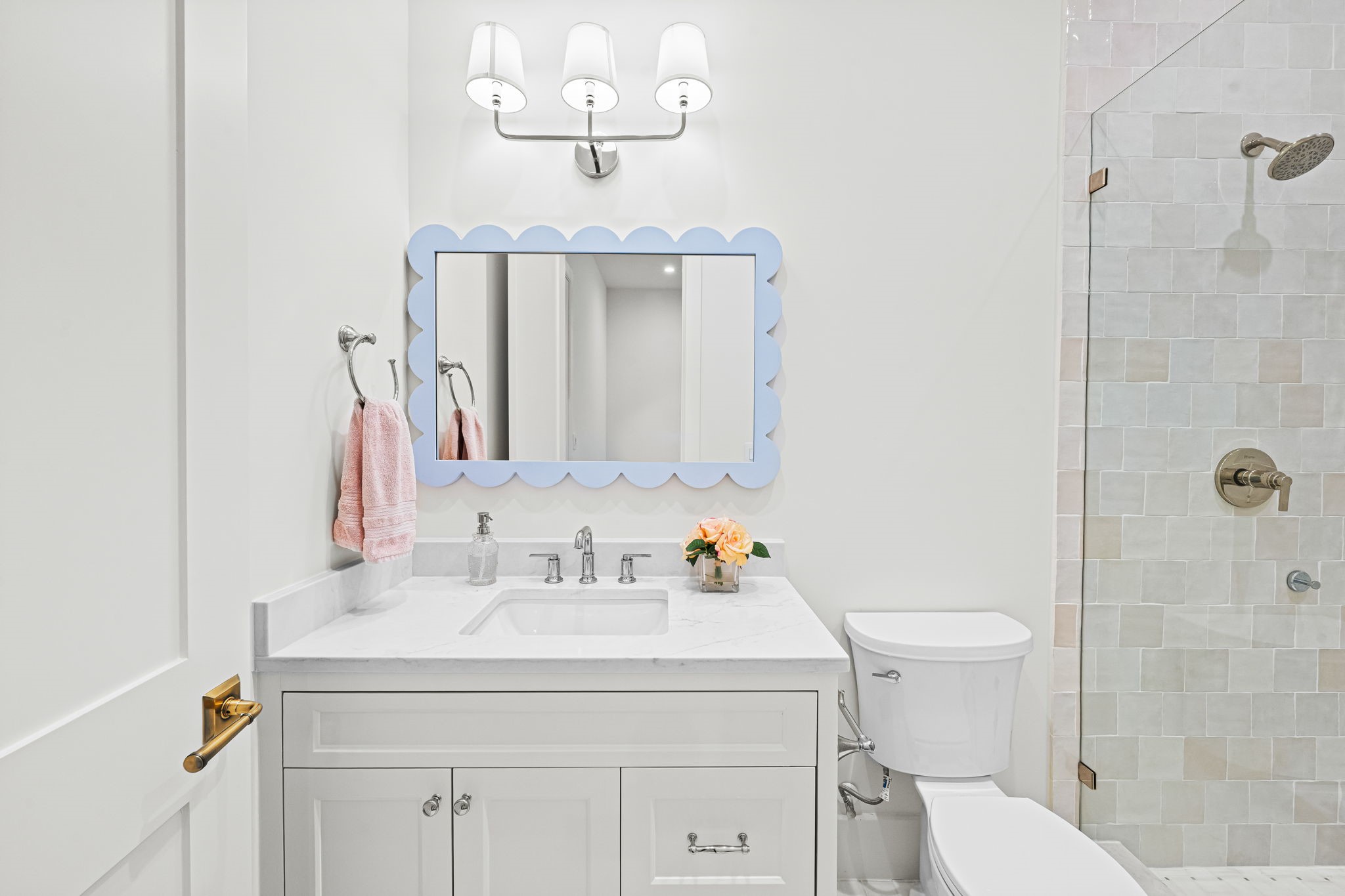 8722 Lupton Lane Houston, TX 77055 - Photo 37 of 44 a bathroom with a sink a toilet and mirror