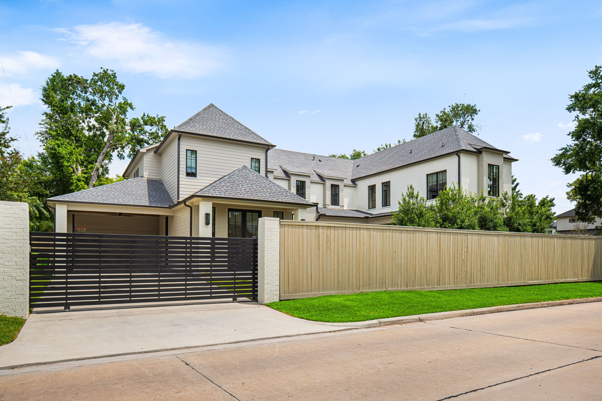 8722 Lupton Lane Houston, TX 77055 - Photo 44 of 44 a side view of a house with a yard and a garage