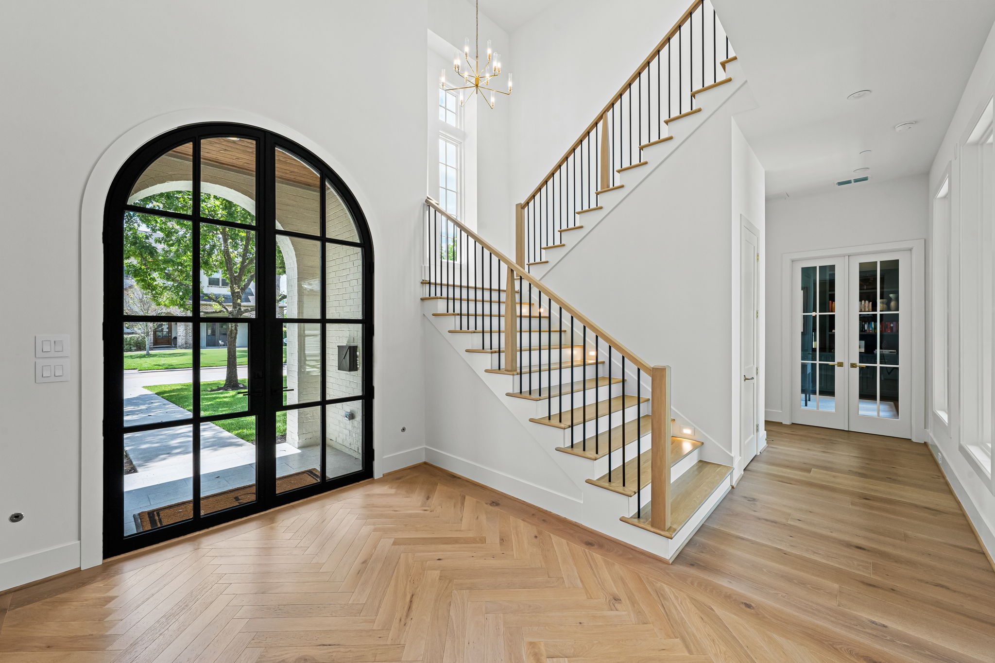 8722 Lupton Lane Houston, TX 77055 - Photo 5 of 44 a view of staircase with railing and a large window