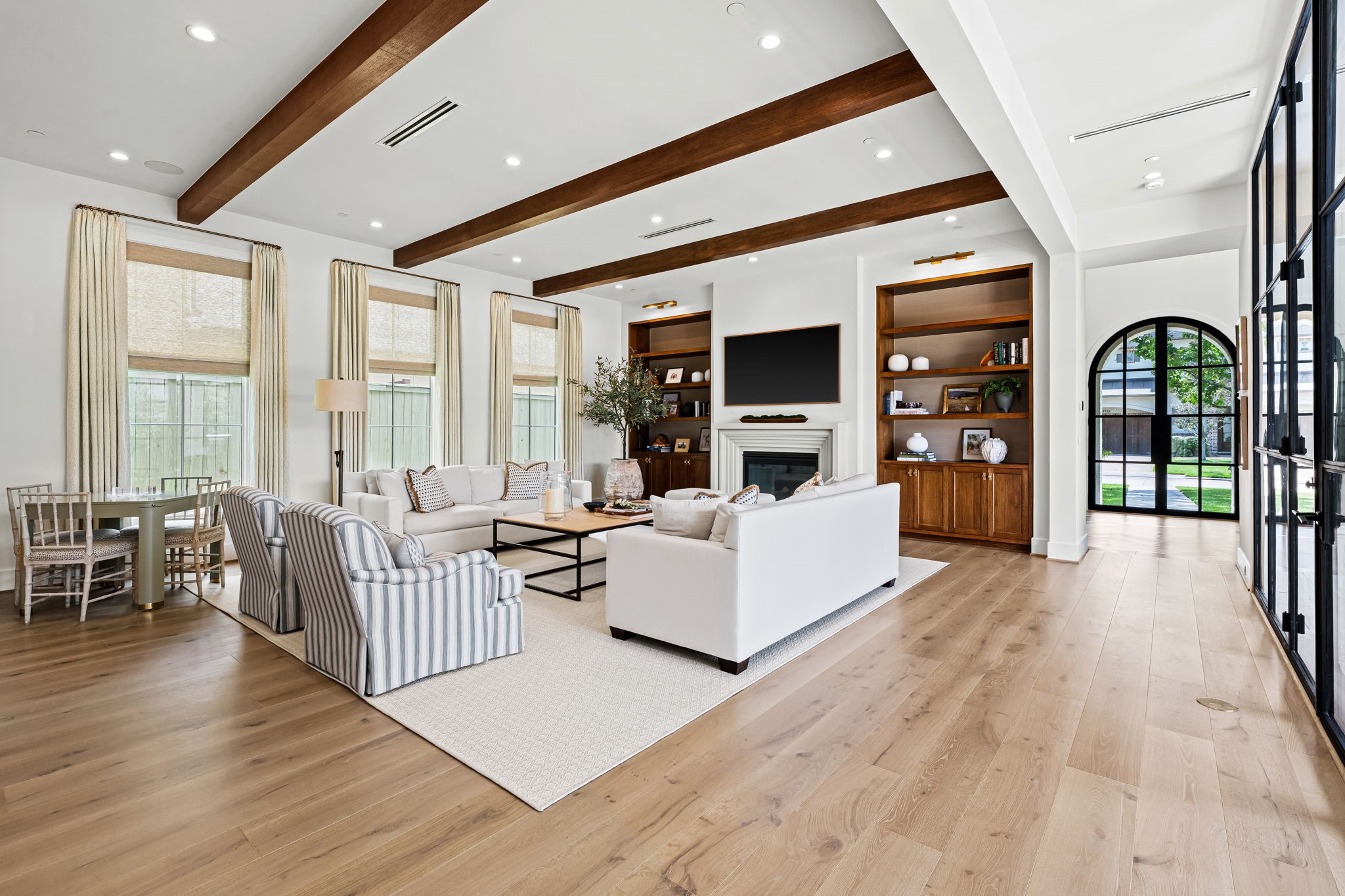 8722 Lupton Lane Houston, TX 77055 - Photo 10 of 44 a living room with furniture and wooden floor