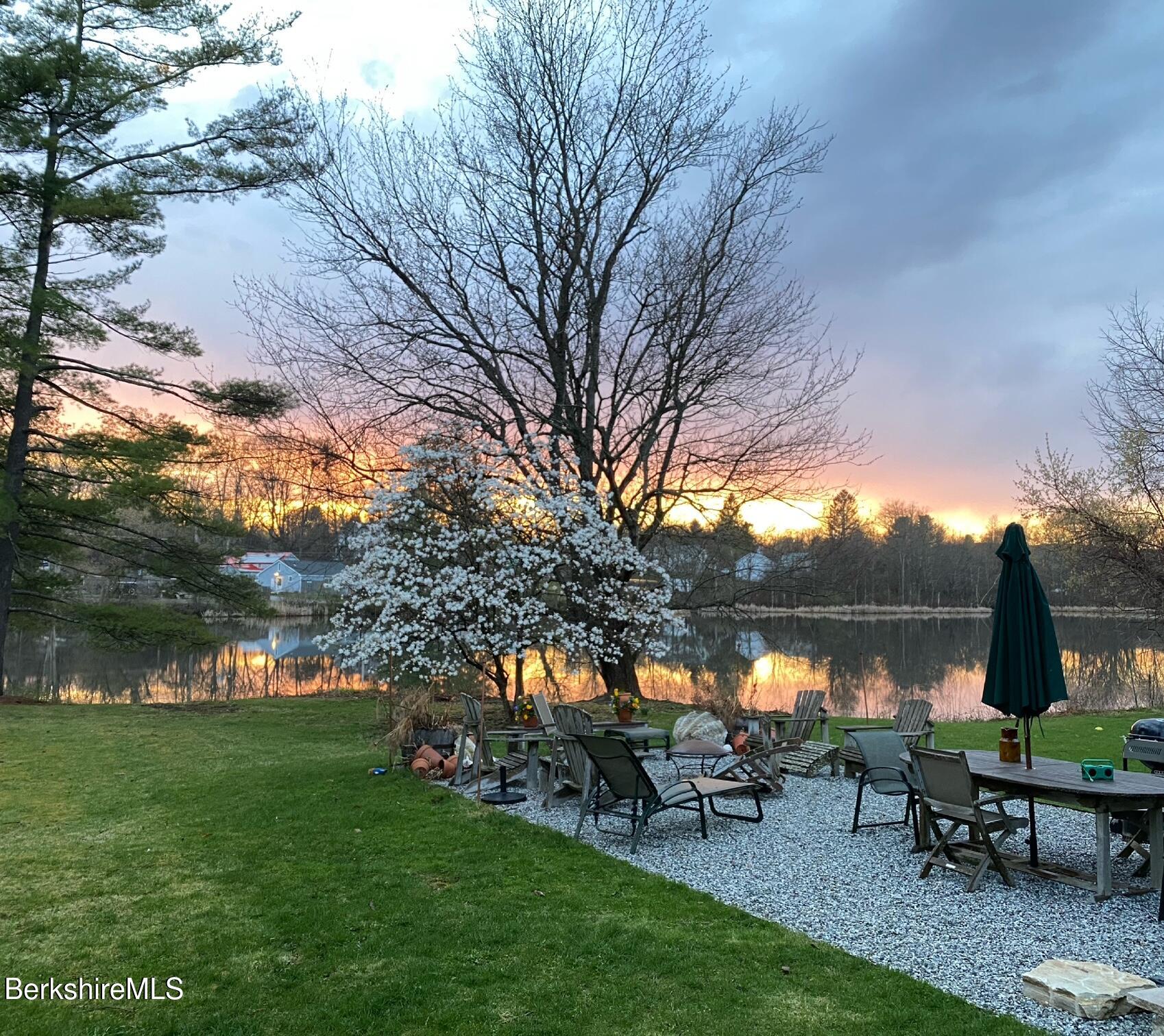 3-5 Swamp Road West Stockbridge, MA 01266 - Photo 24 of 37 a view of a lake with a bench and trees