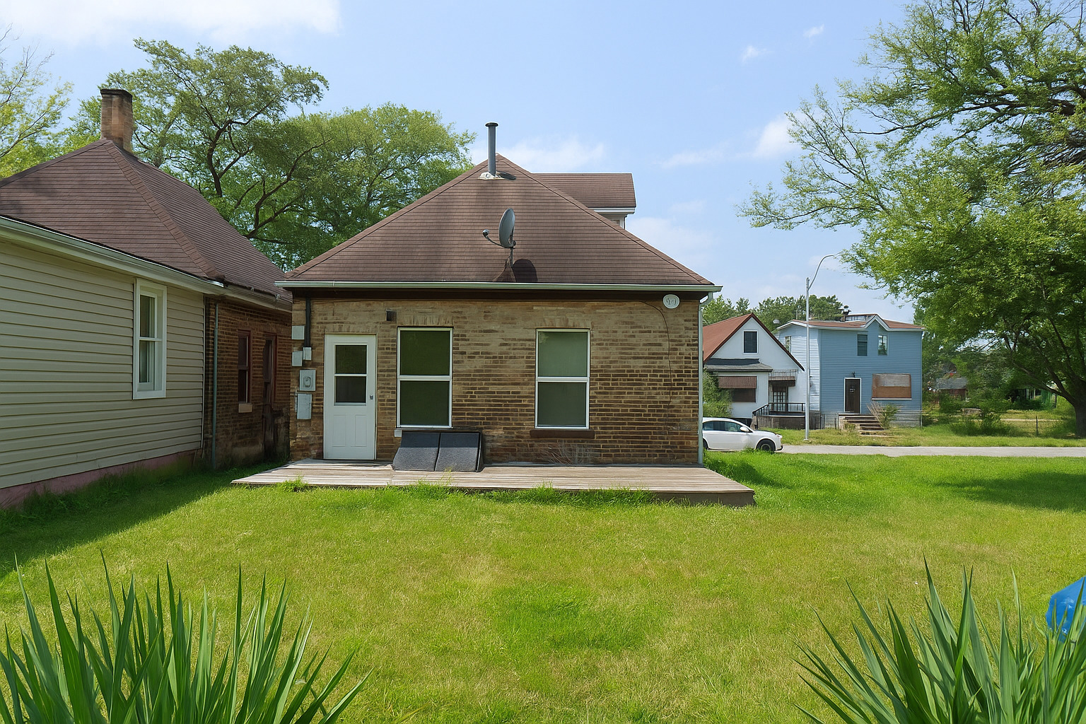 1613 Hanover Street Chicago Heights, IL 60411 - Photo 7 of 7 a front view of a house with a yard and trees