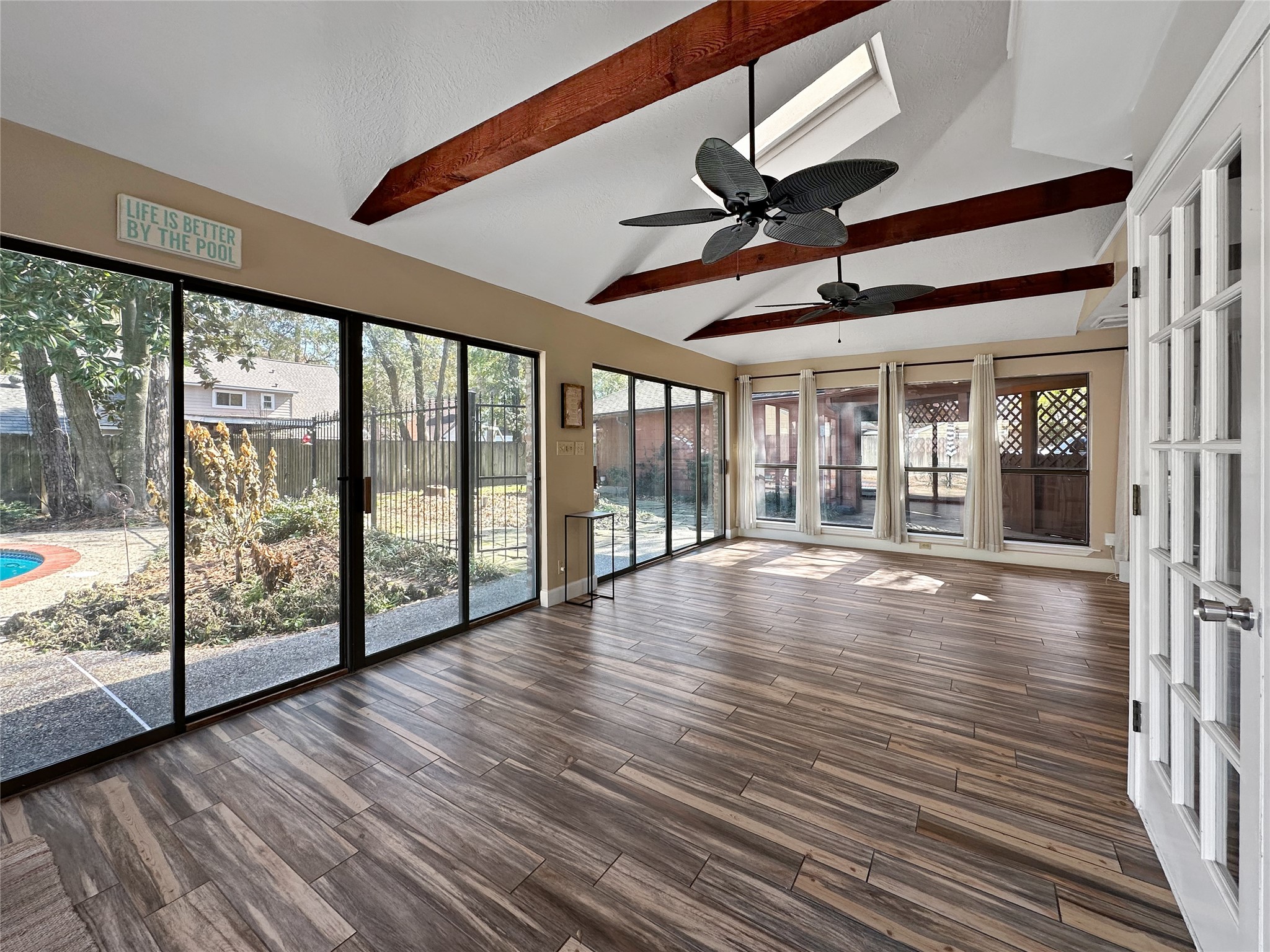 17418 Spicewood Springs Lane Spring, TX 77379 - Photo 12 of 50 a view of empty room with wooden floor and fan