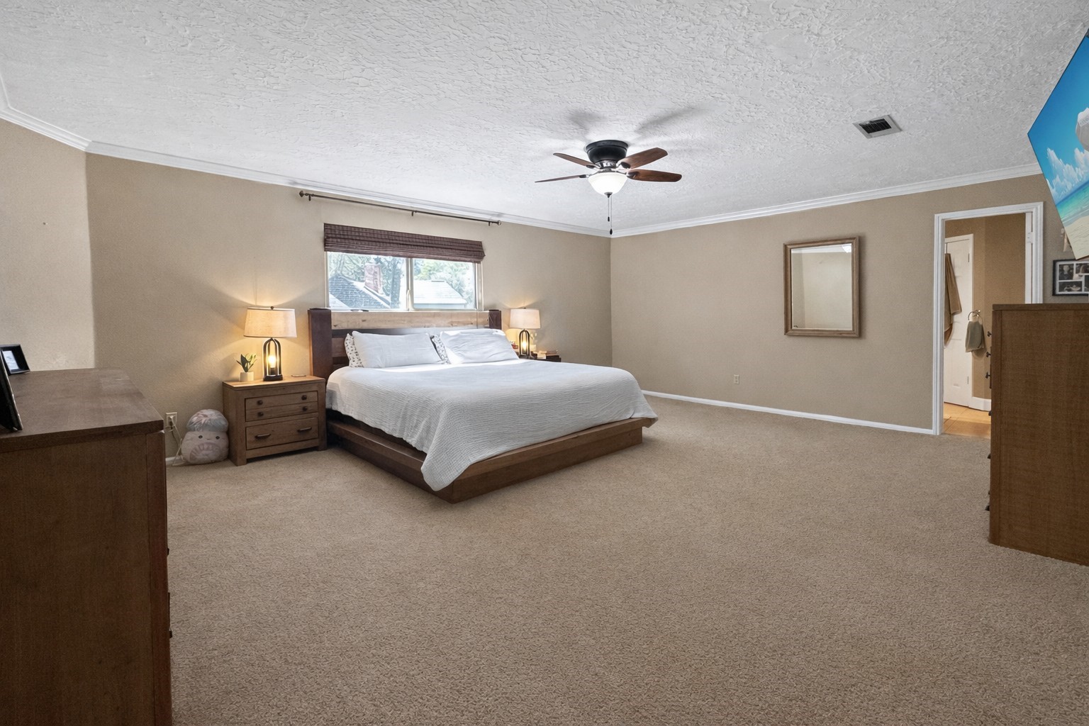 17418 Spicewood Springs Lane Spring, TX 77379 - Photo 13 of 50 a bedroom with a bed and window