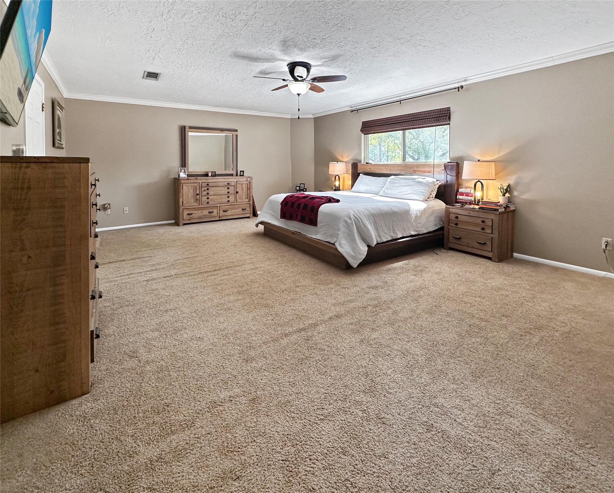 17418 Spicewood Springs Lane Spring, TX 77379 - Photo 14 of 50 a bedroom with a bed and window