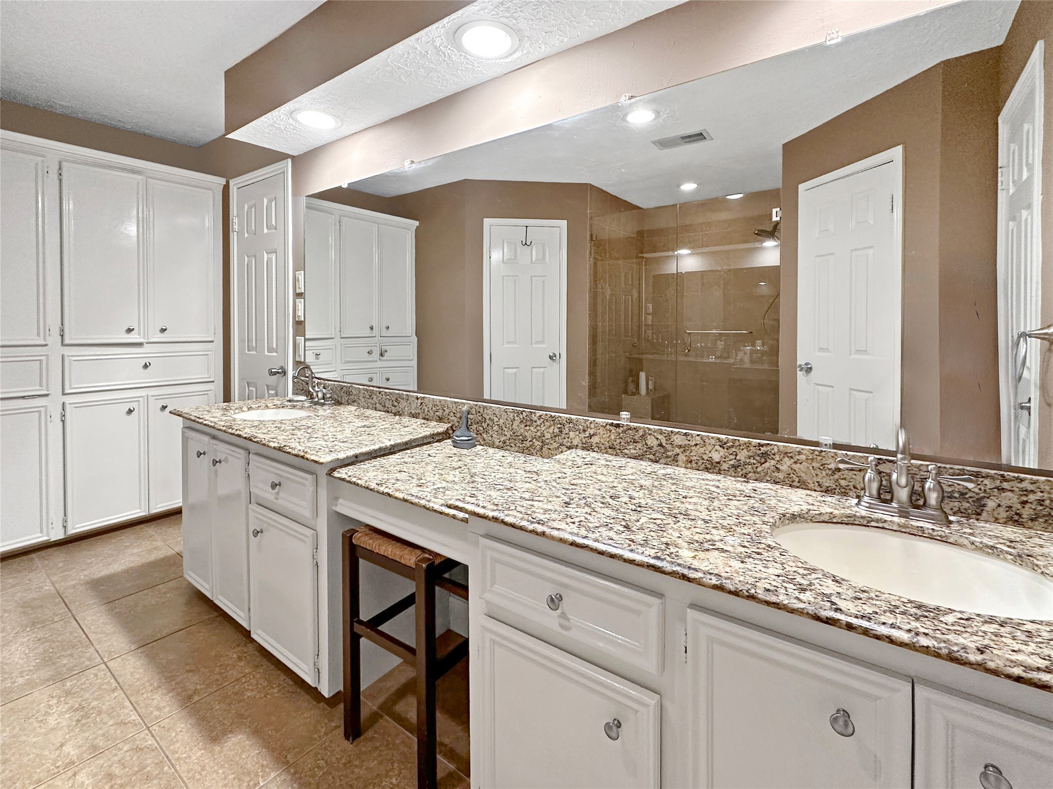17418 Spicewood Springs Lane Spring, TX 77379 - Photo 15 of 50 a bathroom with a granite countertop sink and a mirror