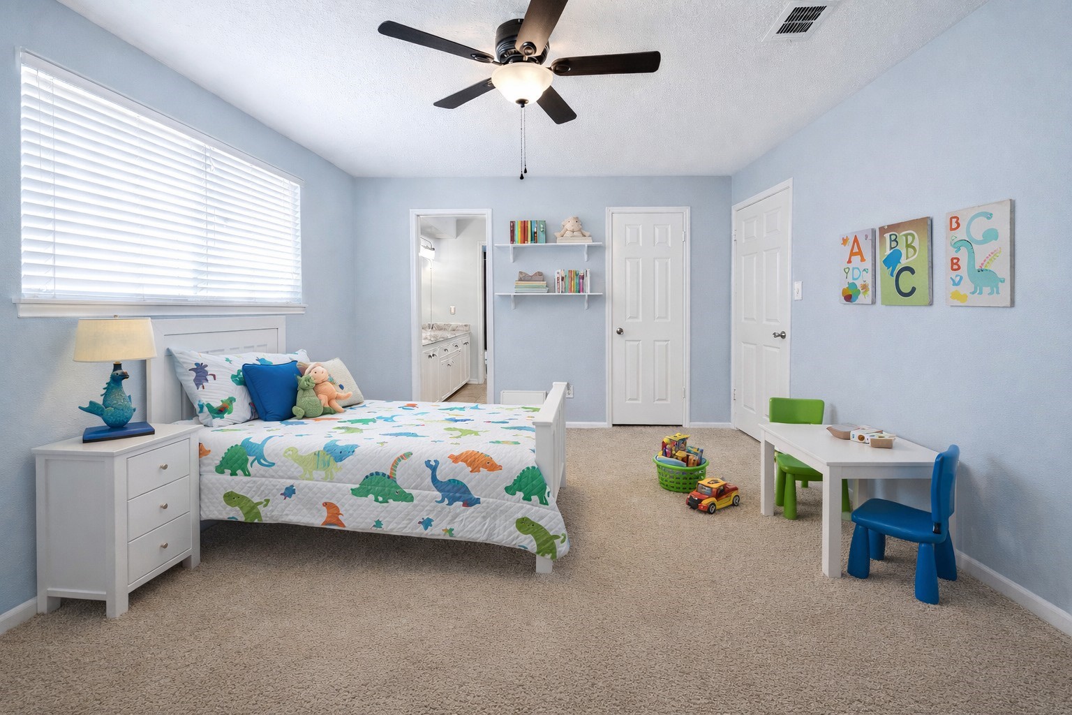 17418 Spicewood Springs Lane Spring, TX 77379 - Photo 18 of 50 a bedroom with a bed and a chandelier