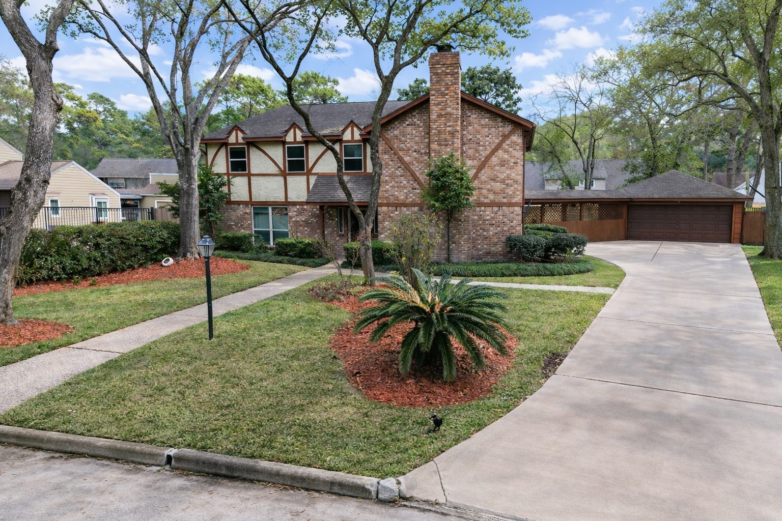 17418 Spicewood Springs Lane Spring, TX 77379 - Photo 2 of 50 a front view of a house with a yard and potted plants