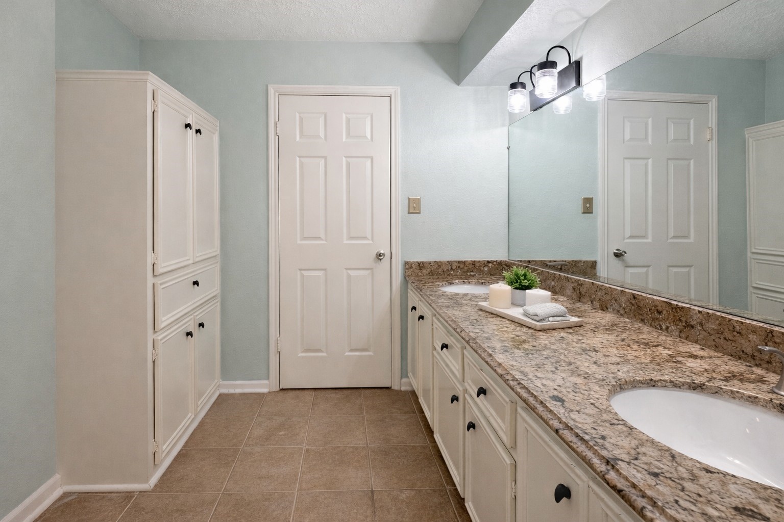 17418 Spicewood Springs Lane Spring, TX 77379 - Photo 19 of 50 a bathroom with a granite countertop sink and a mirror