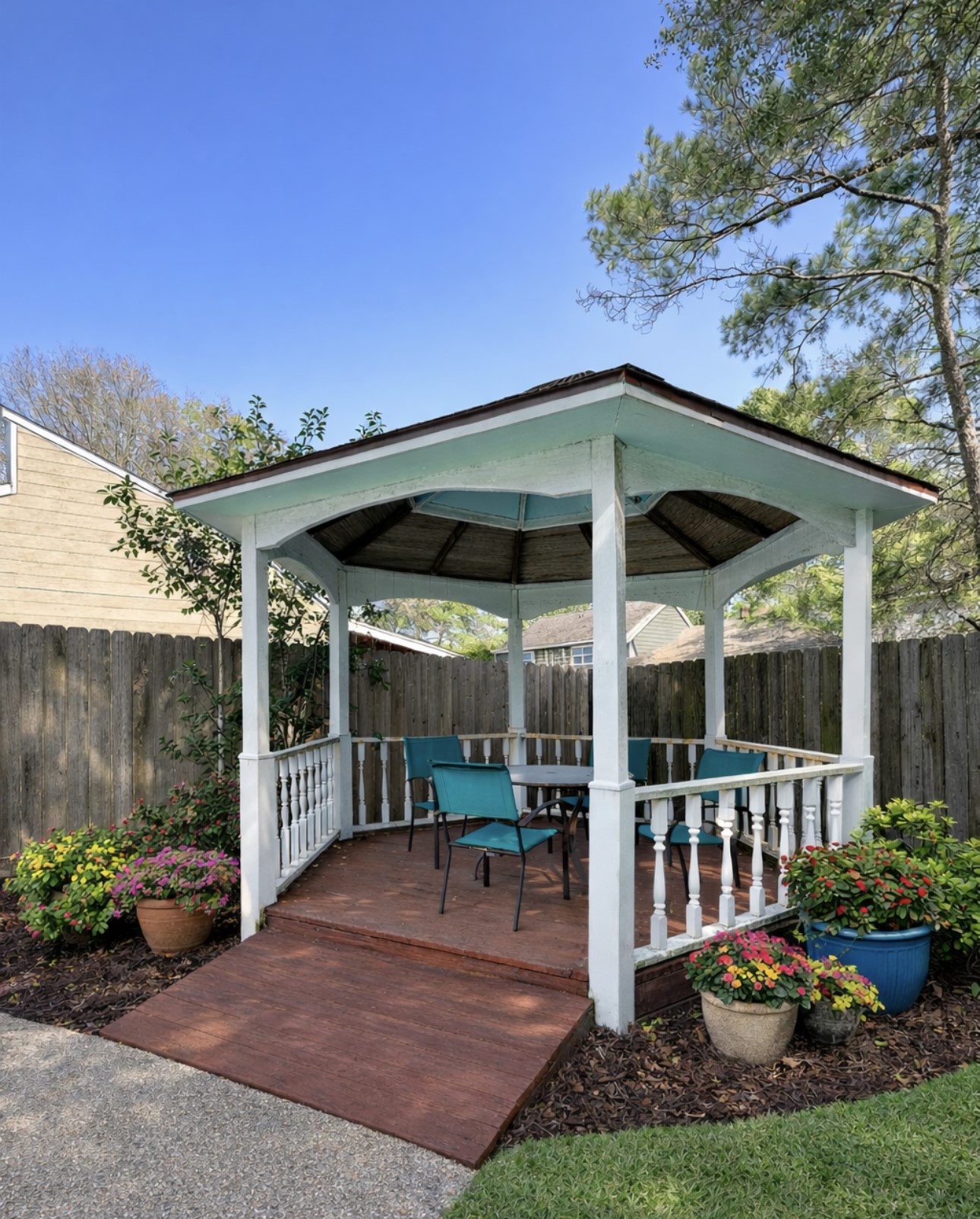 17418 Spicewood Springs Lane Spring, TX 77379 - Photo 22 of 50 a view of a chair and table in backyard of the house