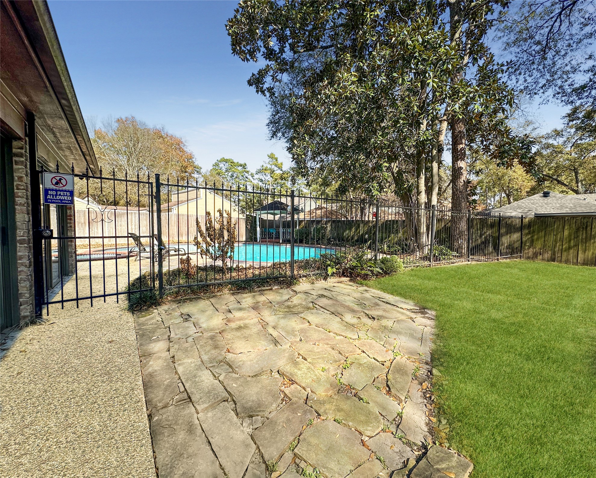 17418 Spicewood Springs Lane Spring, TX 77379 - Photo 26 of 50 a view of backyard with a garden and trees