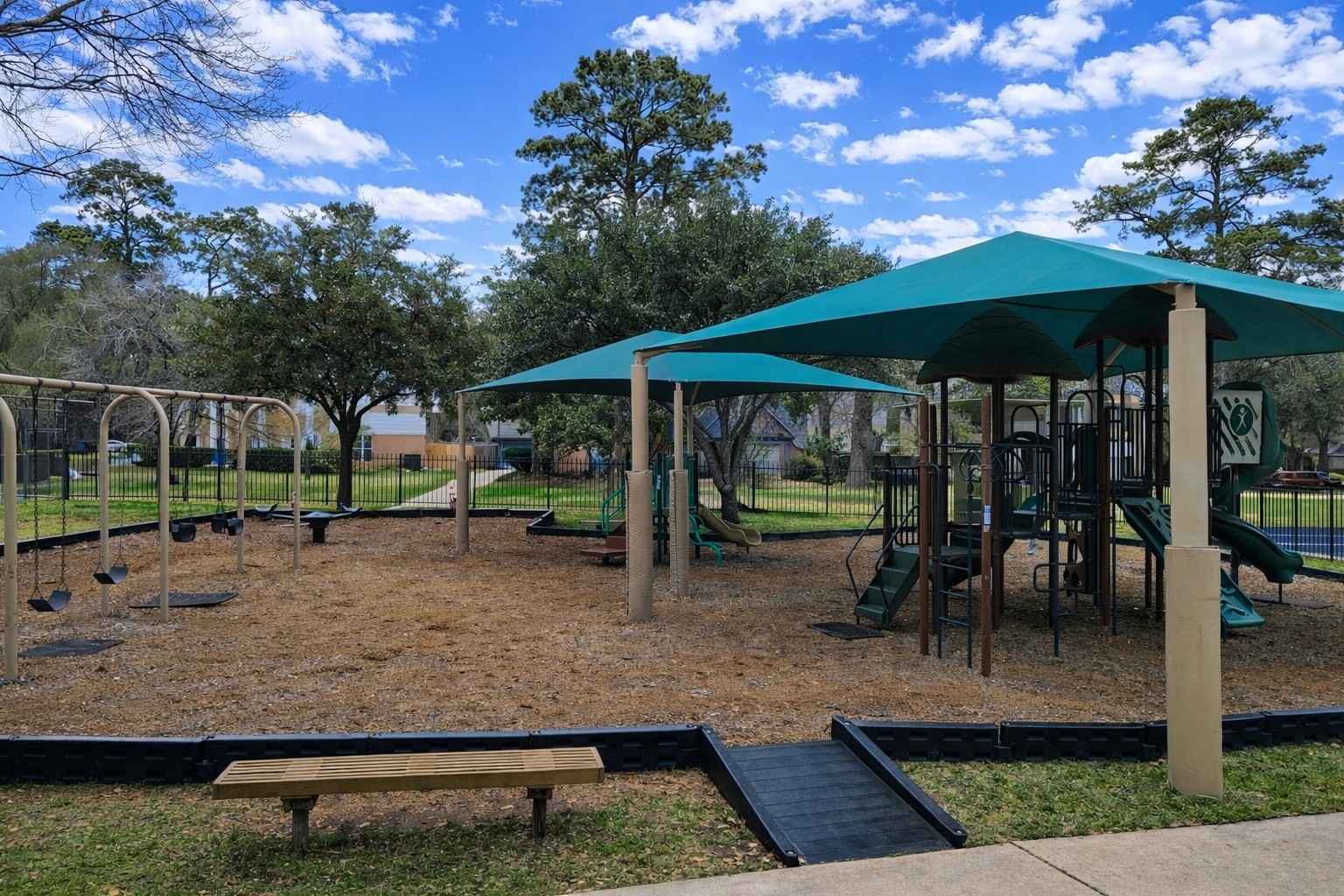 17418 Spicewood Springs Lane Spring, TX 77379 - Photo 33 of 50 a view of a patio with table and chairs under an umbrella