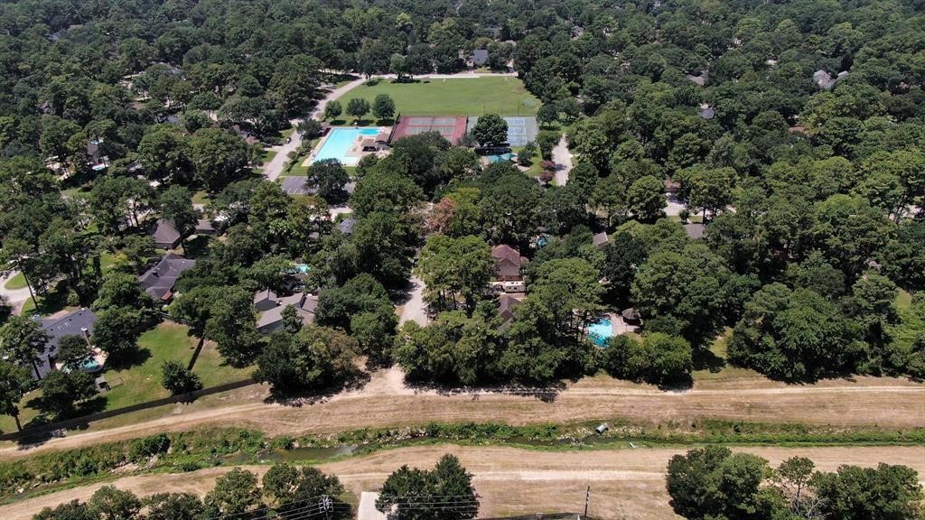 17418 Spicewood Springs Lane Spring, TX 77379 - Photo 46 of 50 an aerial view of a house with a yard and large trees