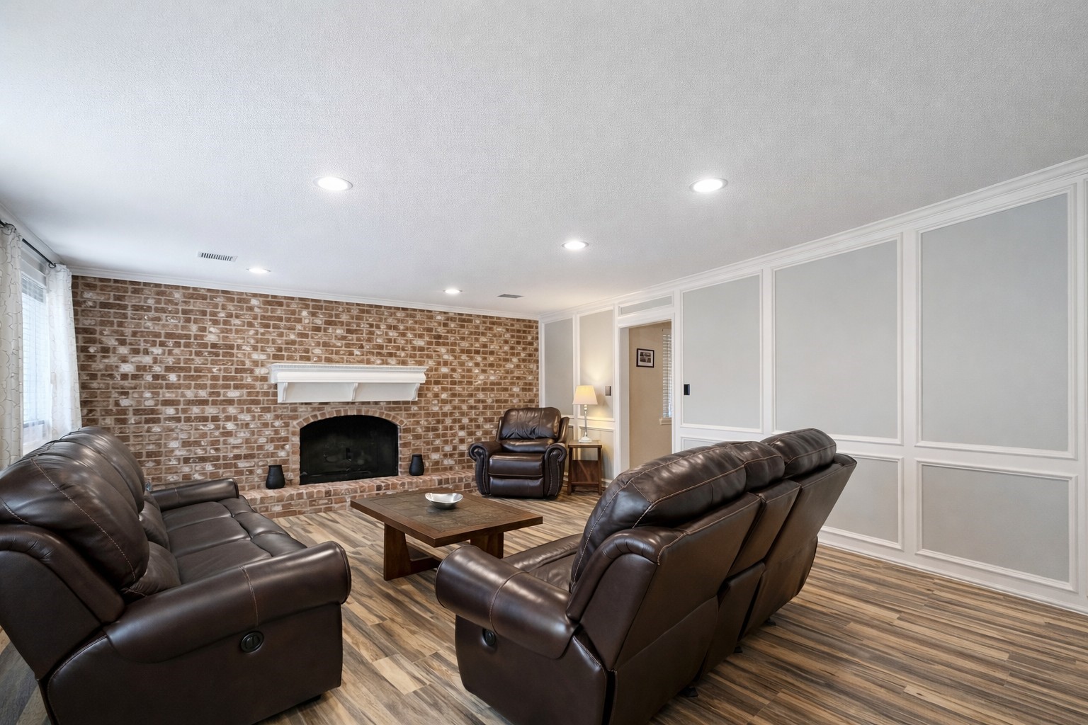 17418 Spicewood Springs Lane Spring, TX 77379 - Photo 5 of 50 a living room with furniture and a fireplace