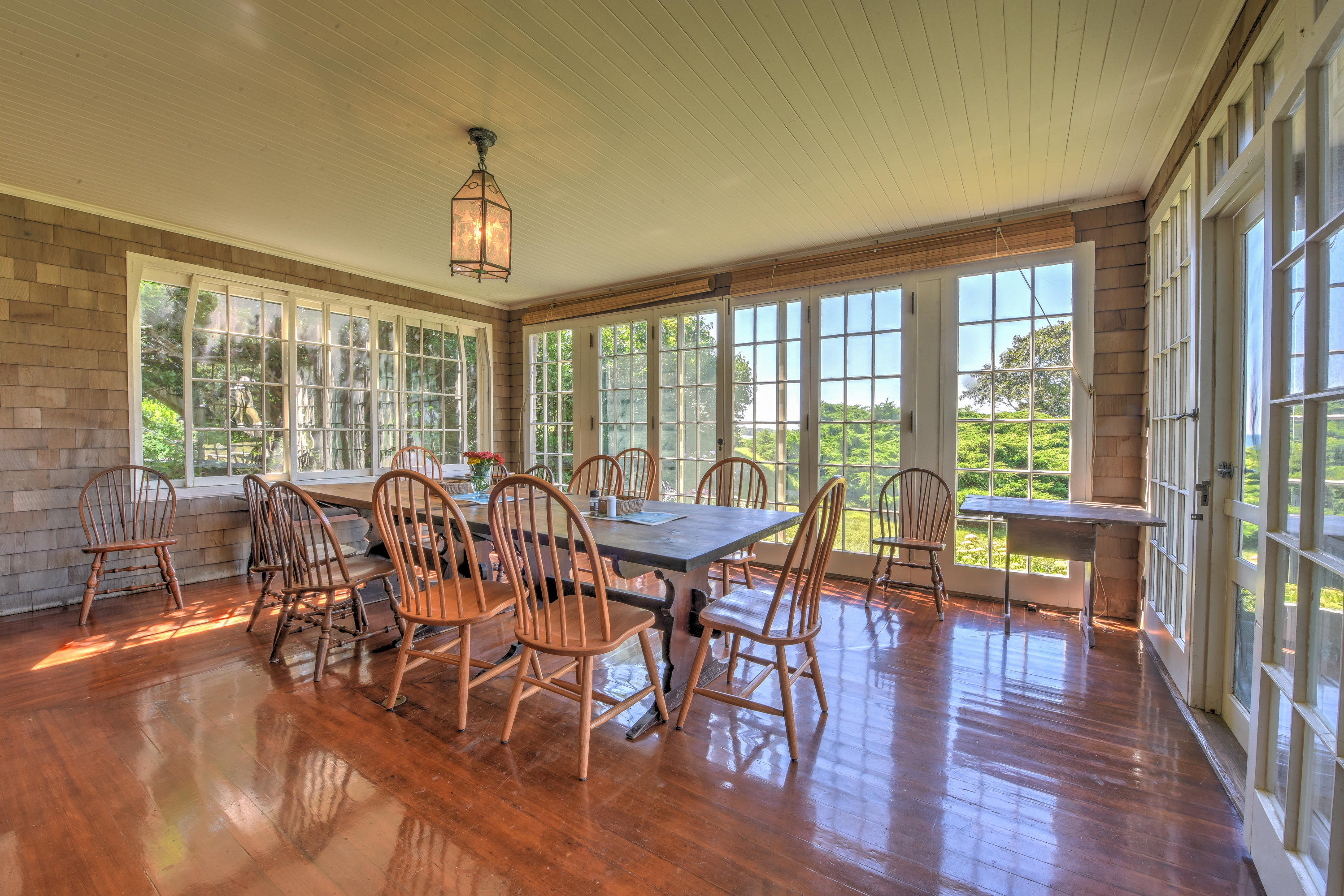 188 Gansett Road Woods Hole, MA 02543 - Photo 12 of 26 a view of a dining room with furniture window and wooden floor