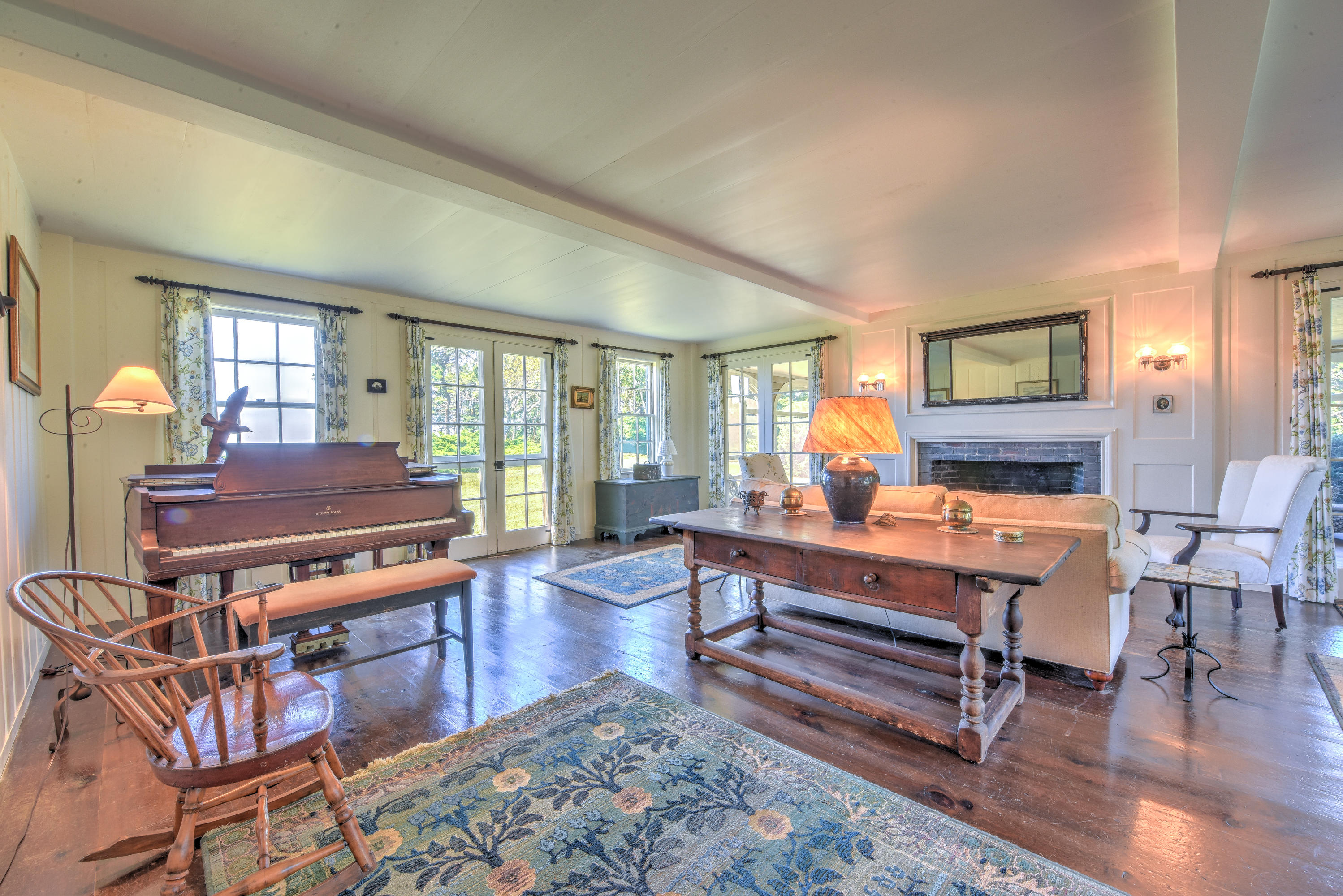 188 Gansett Road Woods Hole, MA 02543 - Photo 14 of 26 a living room with furniture a wooden floor and a table