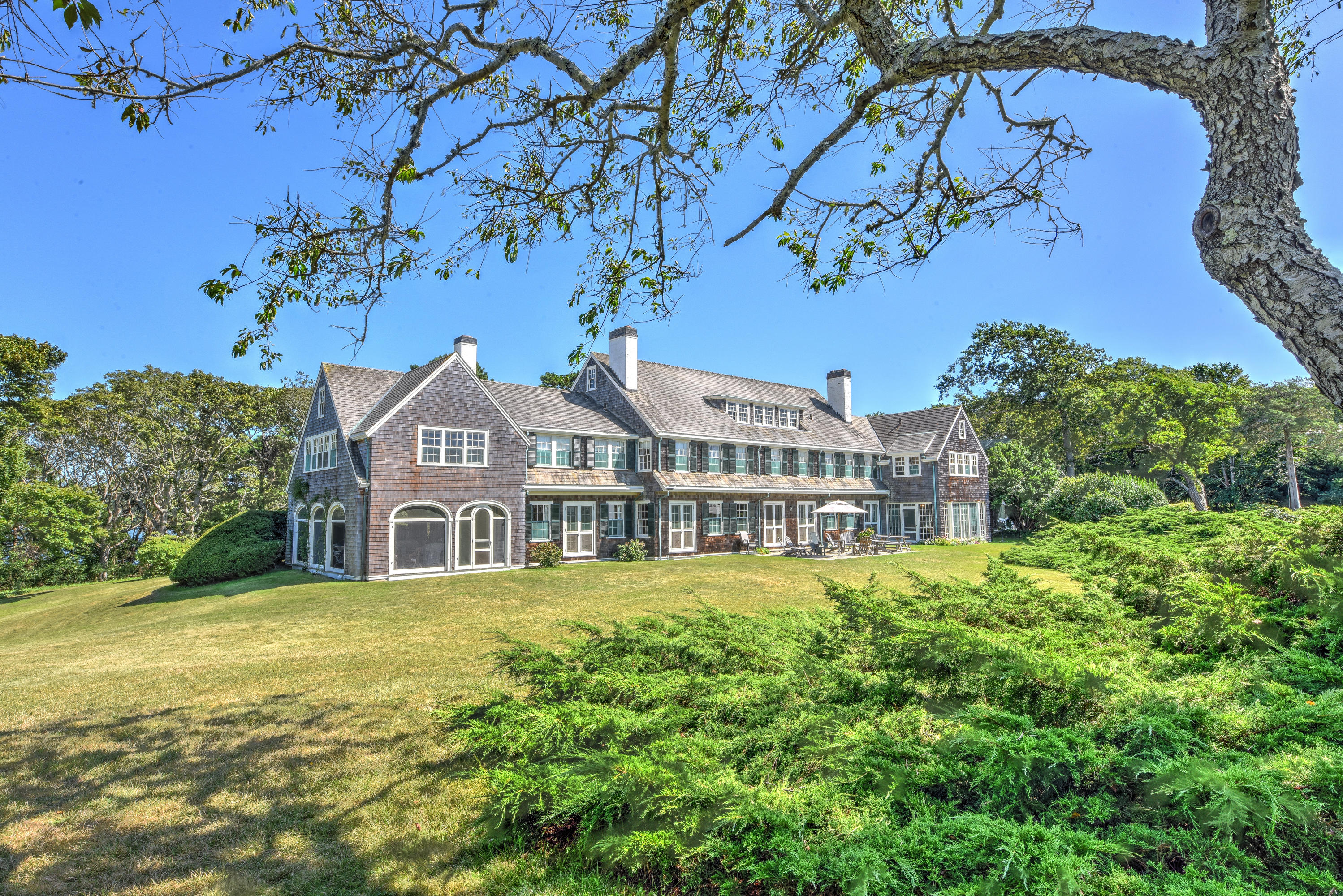 188 Gansett Road Woods Hole, MA 02543 - Photo 19 of 26 a view of a house with a big yard and large trees