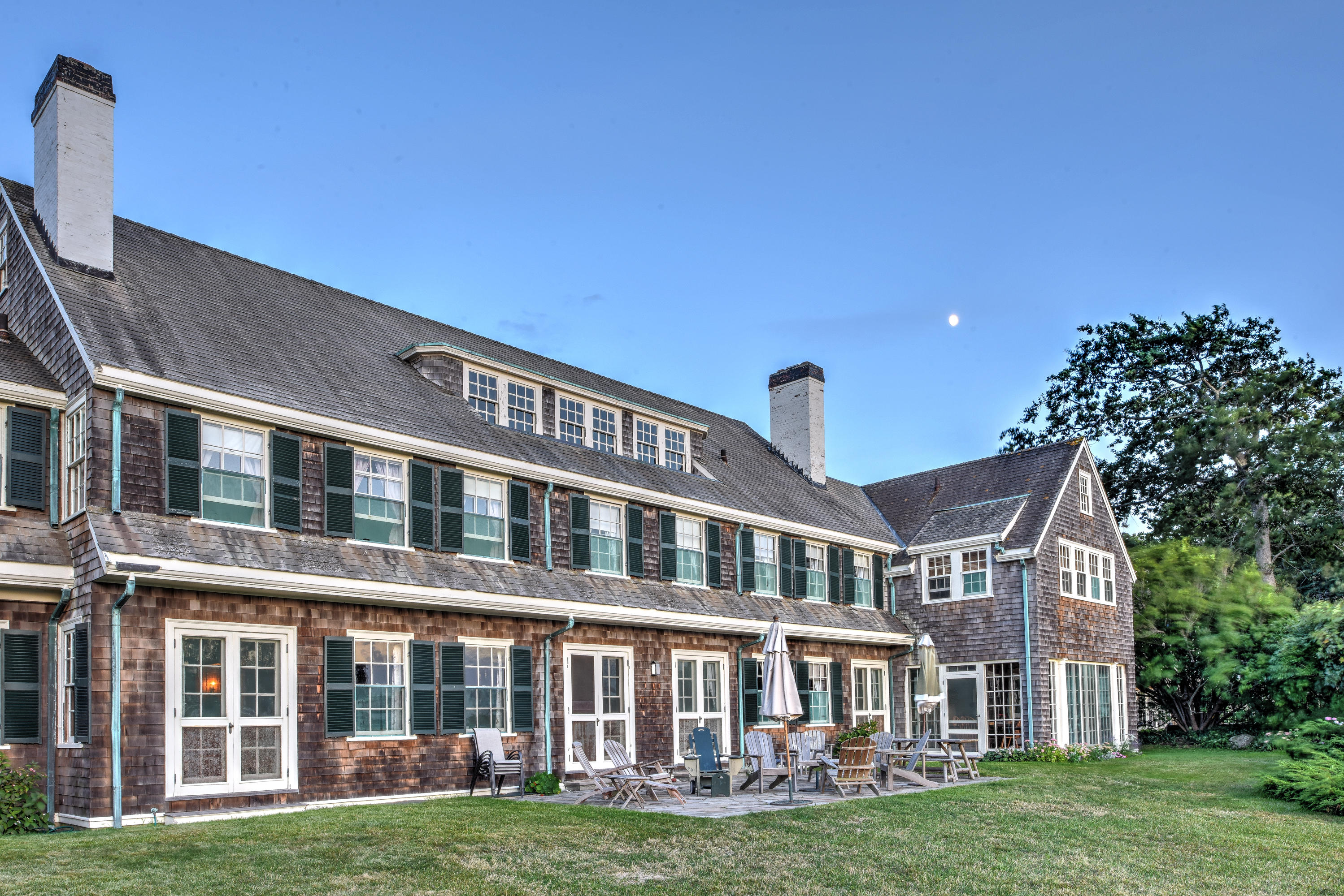 188 Gansett Road Woods Hole, MA 02543 - Photo 20 of 26 a front view of a building with a garden