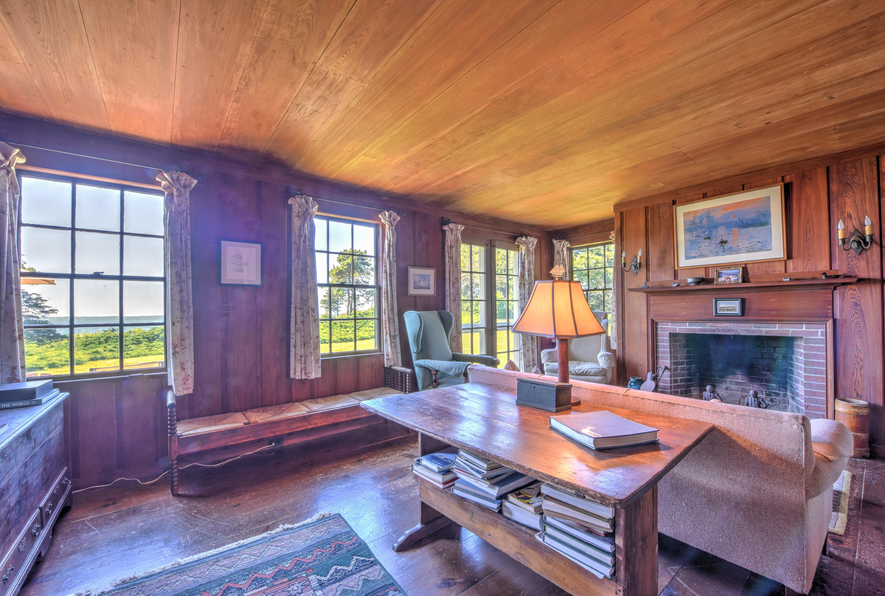 188 Gansett Road Woods Hole, MA 02543 - Photo 10 of 26 a living room with furniture a fireplace and a flat screen tv