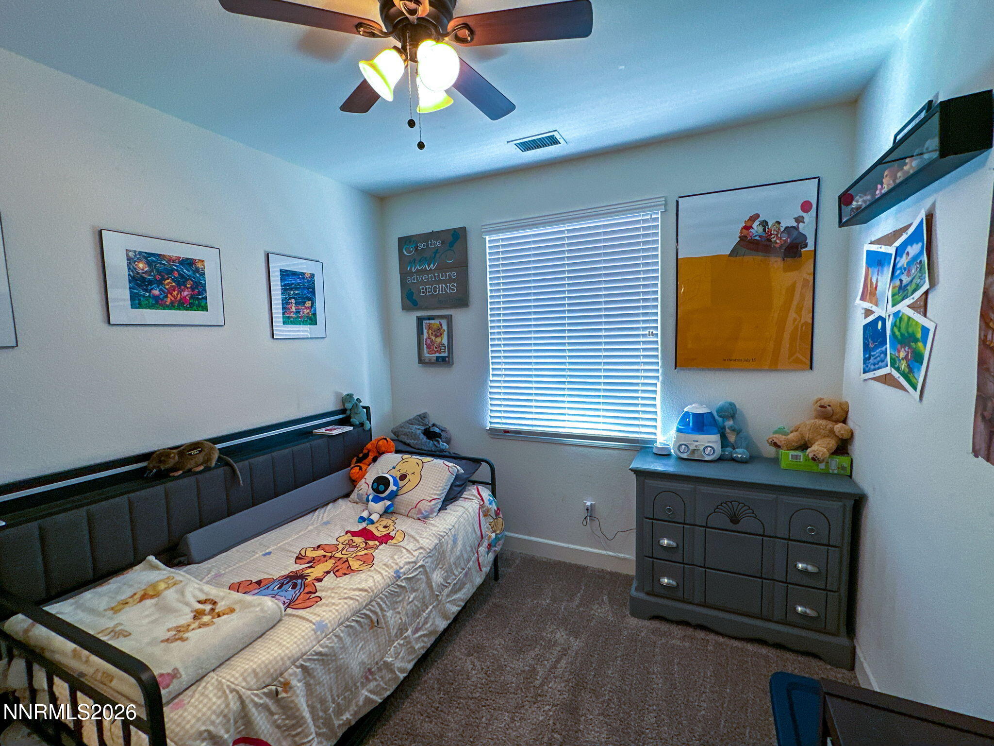 7330 Overture Drive Reno, NV 89506 - Photo 12 of 17 a bedroom with a bed and a dresser in it