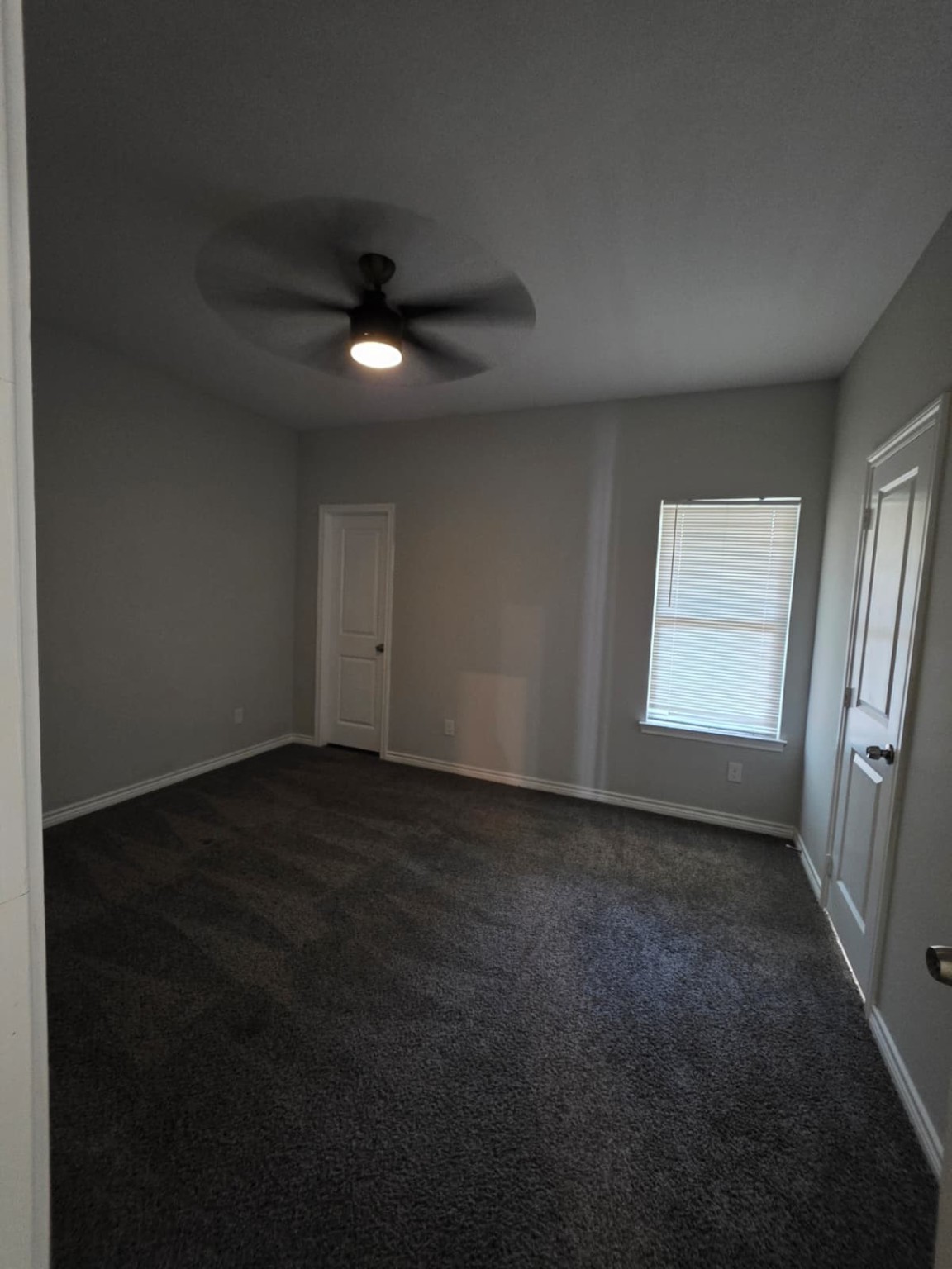 16338 Eastchase Street Montgomery, TX 77316 - Photo 5 of 12 an empty room with a empty space and windows