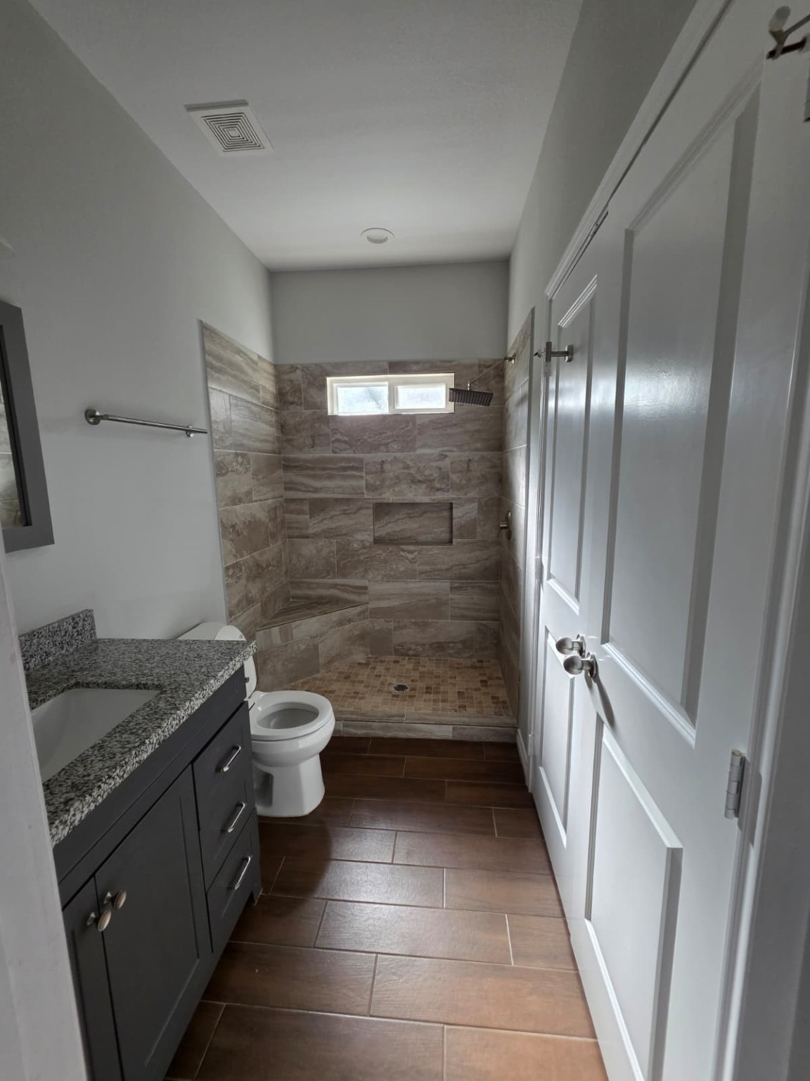 16338 Eastchase Street Montgomery, TX 77316 - Photo 7 of 12 a bathroom with a granite countertop sink toilet and shower