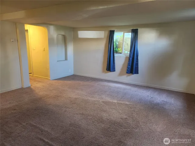 a kitchen with a refrigerator sink and cabinets