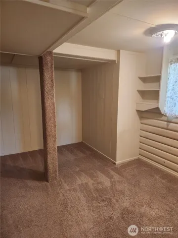 a bathroom with a shower and a sink