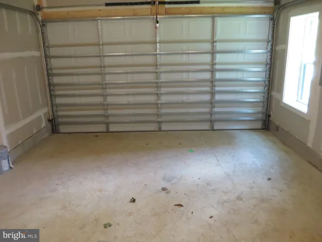 a view of an empty room and fire place