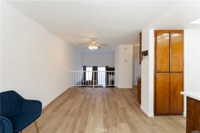 a kitchen with kitchen island a refrigerator stove microwave and cabinets