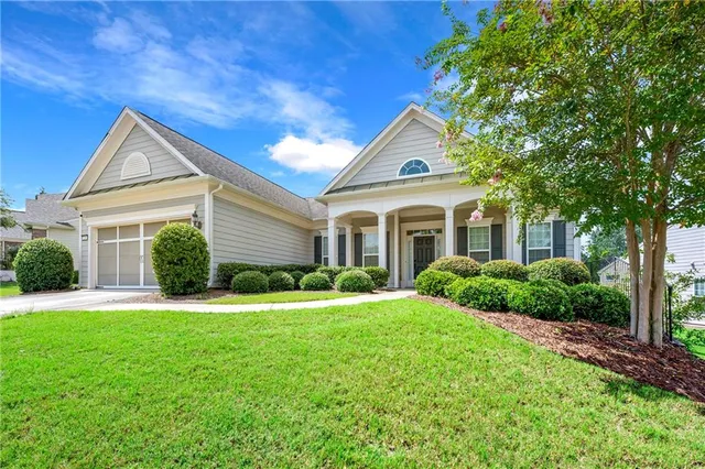 a front view of a house with a yard