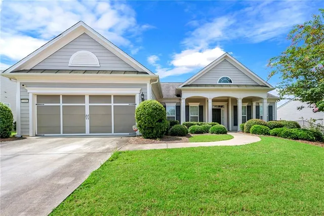 a front view of a house with a yard