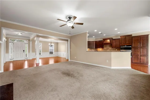 a view of kitchen and hall with stainless steel appliances