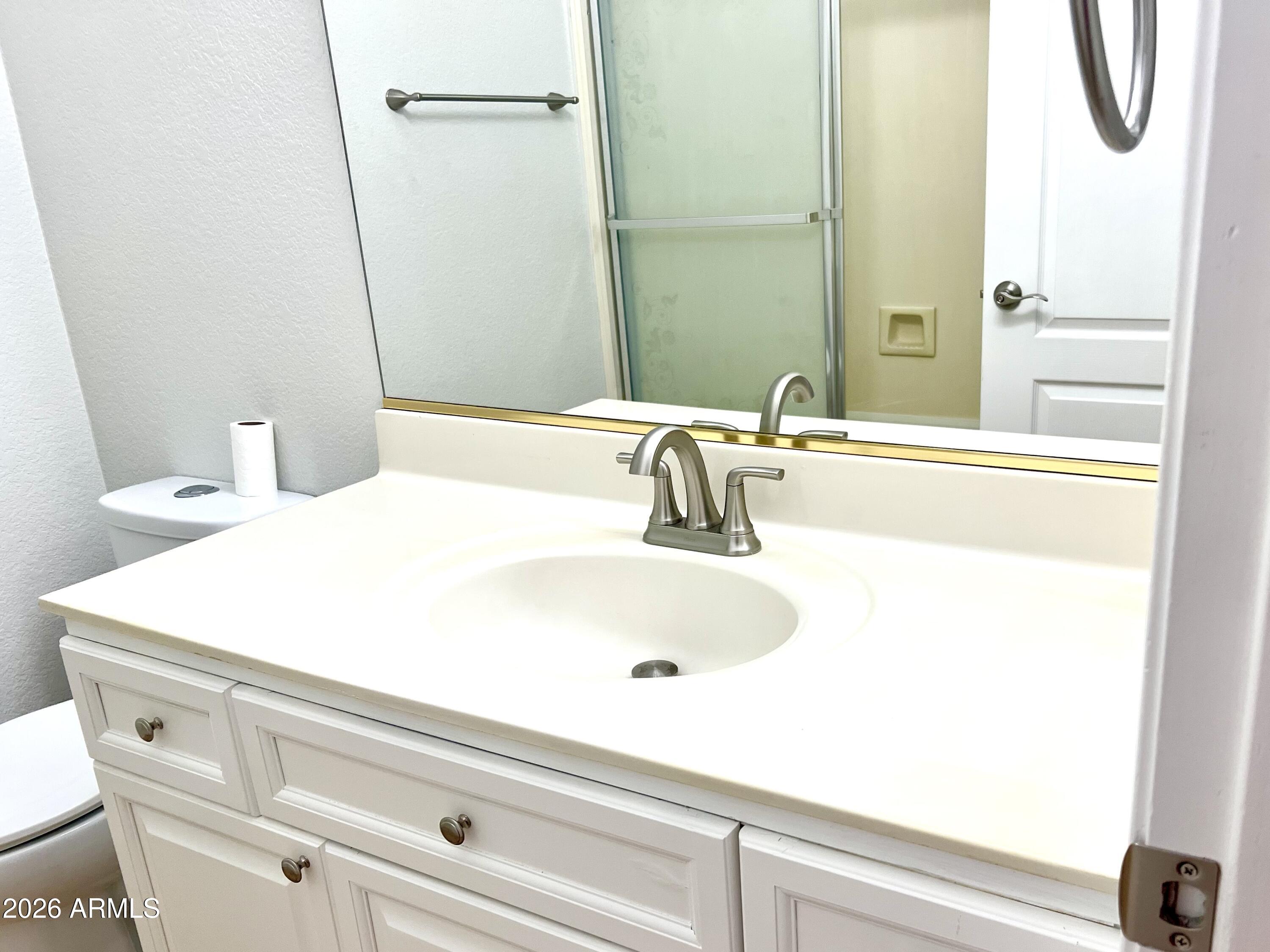 407 West Helena Drive Phoenix, AZ 85023 - Photo 16 of 35 a bathroom with a sink and a mirror