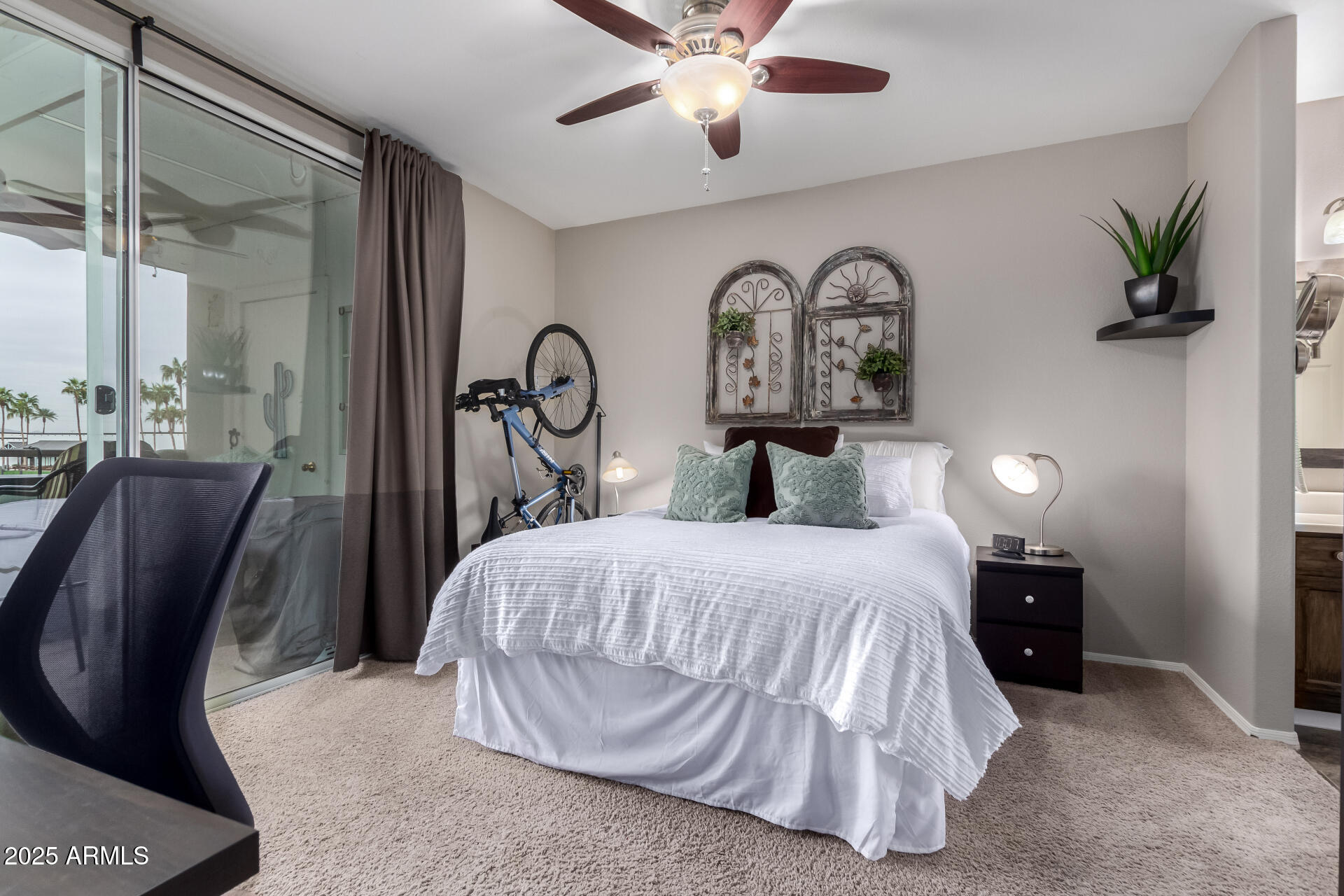 1825 West Ray Road, Unit 2116 Chandler, AZ 85224 - Photo 13 of 44 a bedroom with a bed and a chandelier