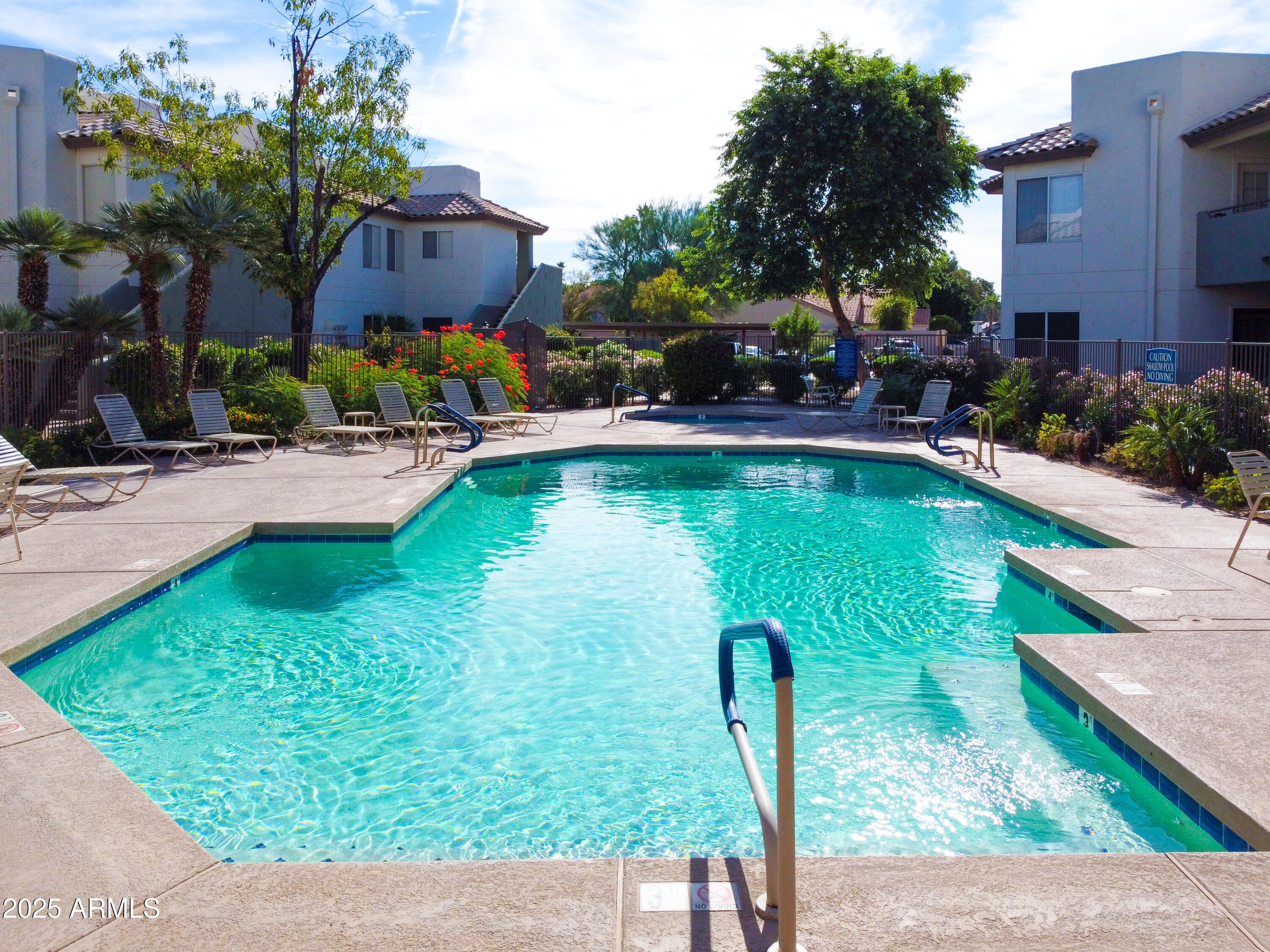 1825 West Ray Road, Unit 2116 Chandler, AZ 85224 - Photo 25 of 44 a swimming pool with outdoor seating and yard
