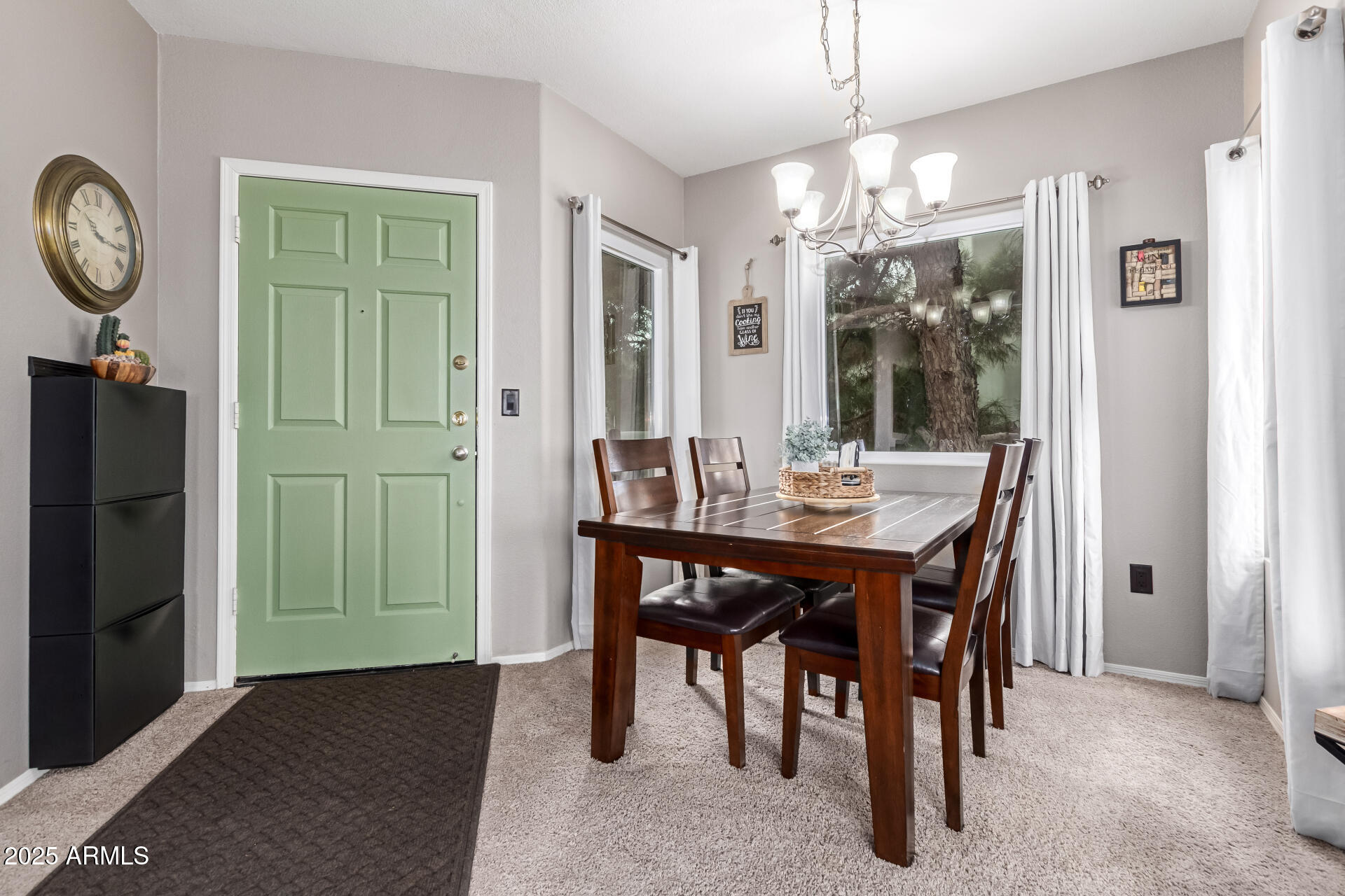 1825 West Ray Road, Unit 2116 Chandler, AZ 85224 - Photo 4 of 44 a view of a dining room with furniture window and wooden floor